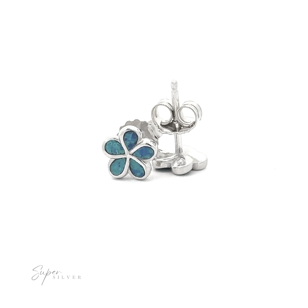 
                  
                    A pair of Small Plumeria stud earrings featuring sterling silver flower shapes with blue lab-created opal inlay.
                  
                