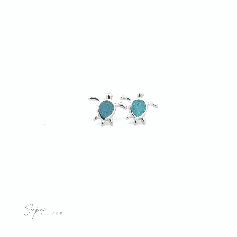 
                  
                    The Simple Lab-Created Opal Turtle Studs feature two sterling silver sea turtle stud earrings with turquoise-colored shells on a white background. The text "Super Silver" is in the bottom left corner.
                  
                