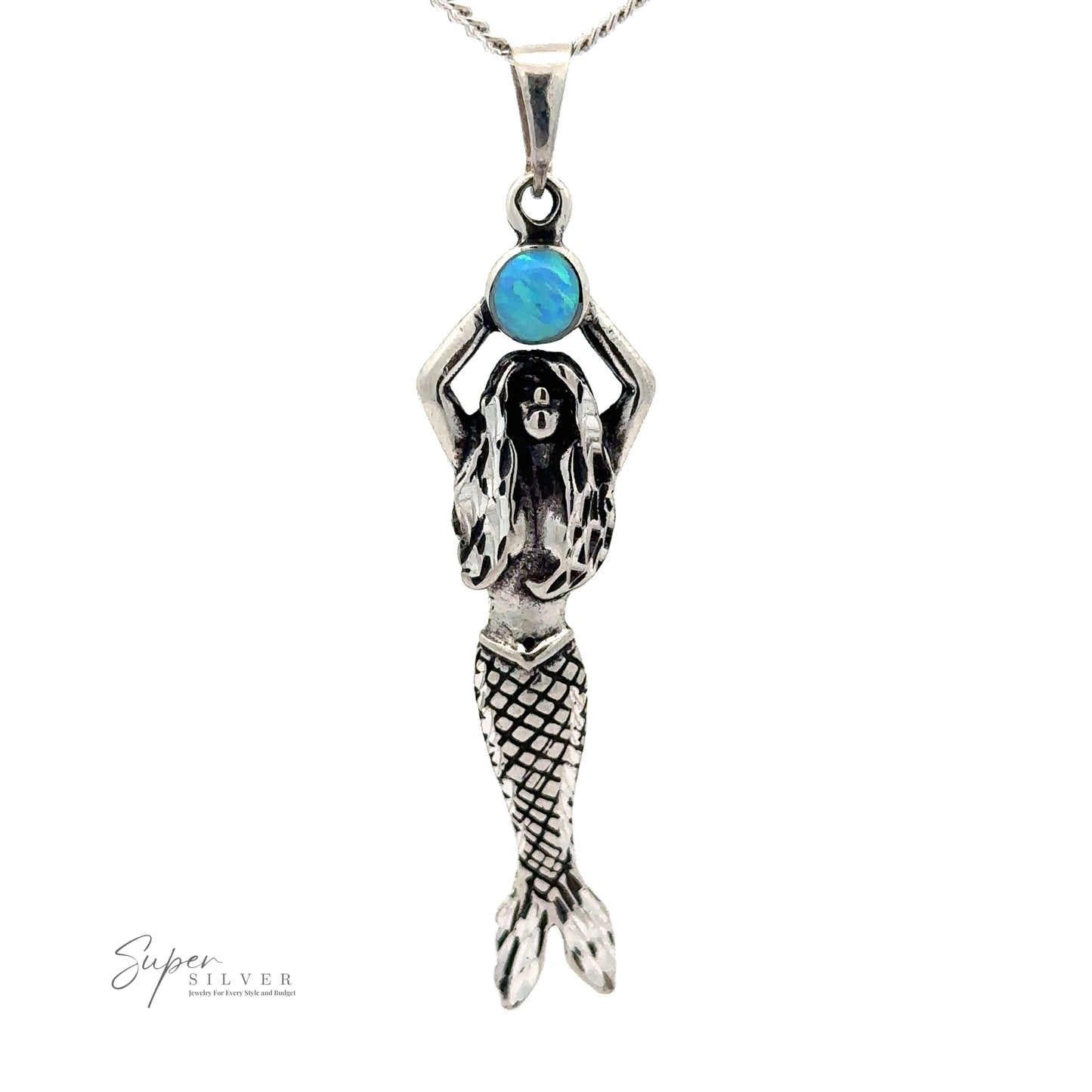 
                  
                    Mermaid And Opal Pendant with intricate details, holding a blue opal stone above her head. Text in the image reads "Super Silver".
                  
                