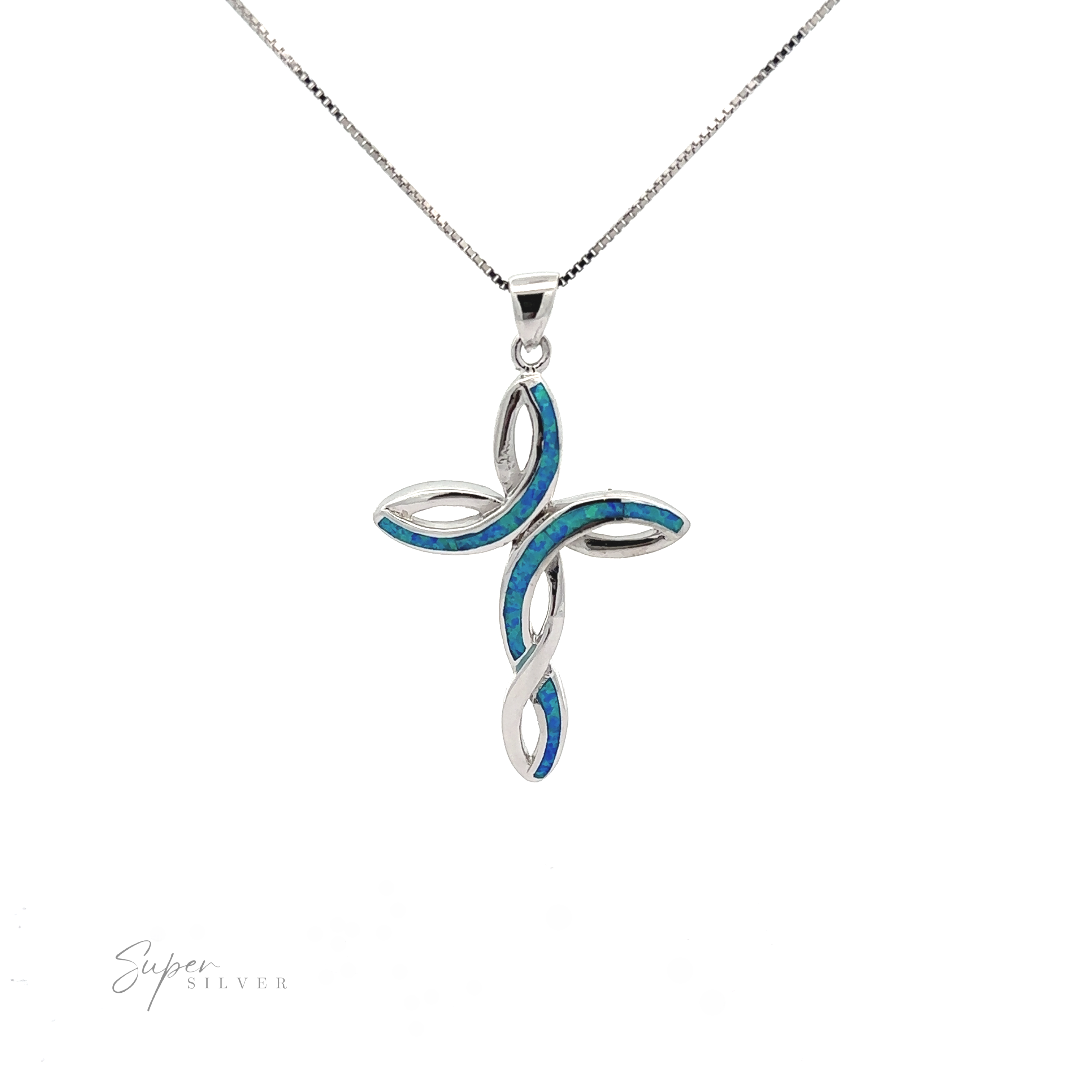 A opal cross pendant with a swirling design and blue inlay on a delicate chain, displayed against a white background.