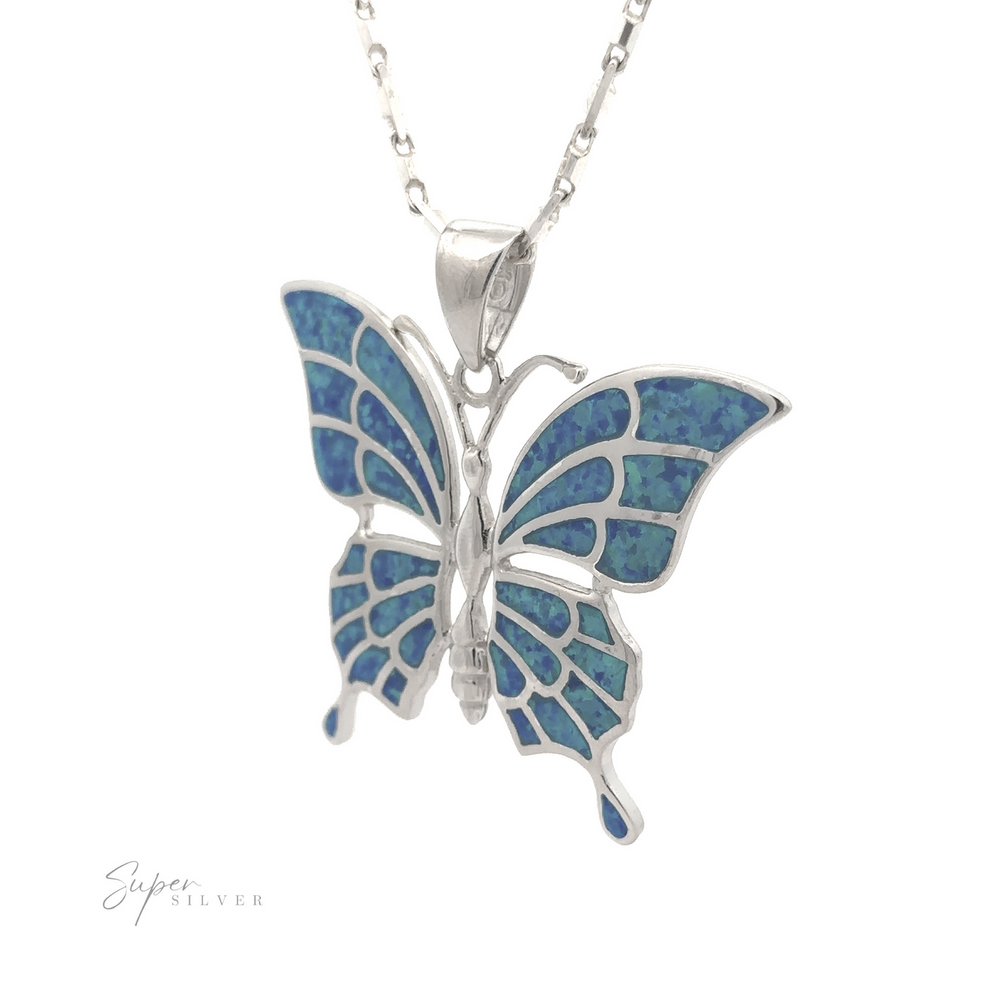 
                  
                    The Statement Lab-Created Opal Butterfly Pendant is a stunning sterling silver necklace showcasing a butterfly pendant with intricate blue designs and lab-created opal in its wings. The thin, delicate chain highlights the elegance of this piece, with the brand name "Super Silver" visible in the bottom left corner.
                  
                