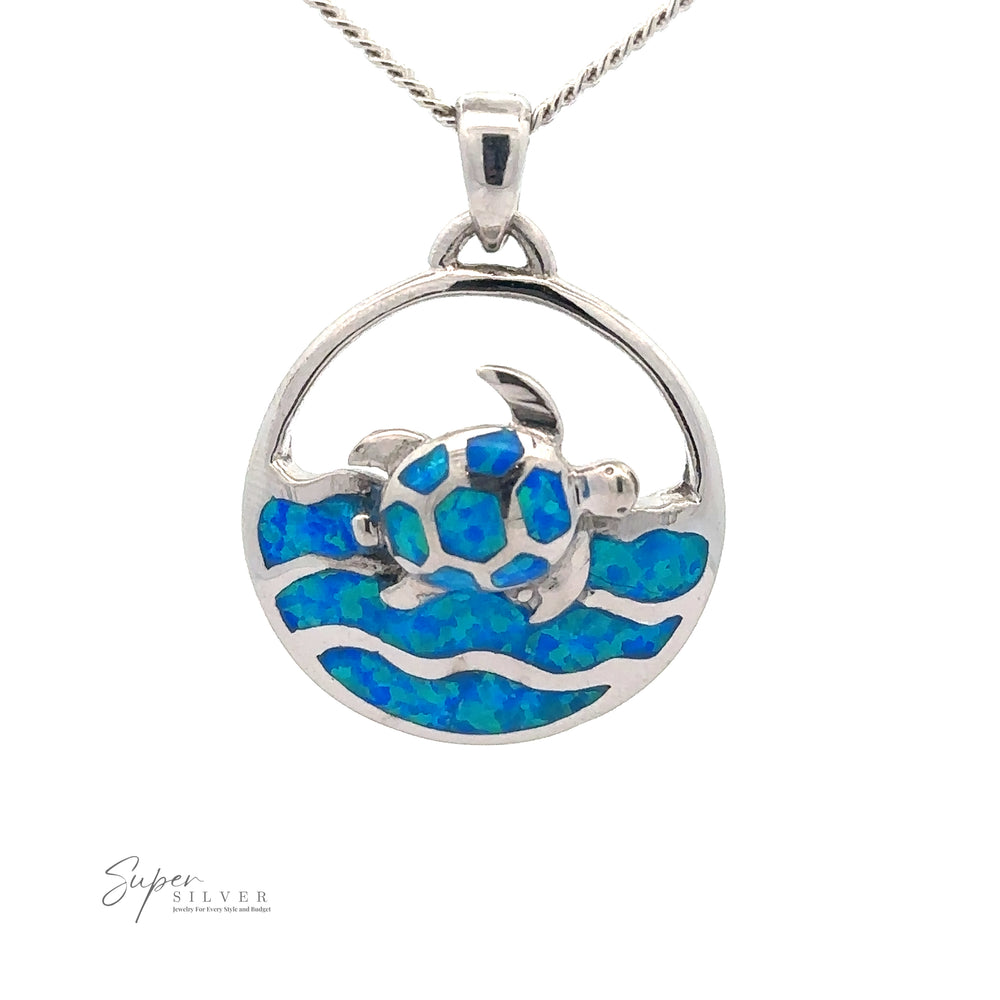 A Blue Opal Sea Turtle Pendant featuring a sea turtle with a blue inlay, swimming in opal waves. The oceanic jewelry piece is on a silver chain.