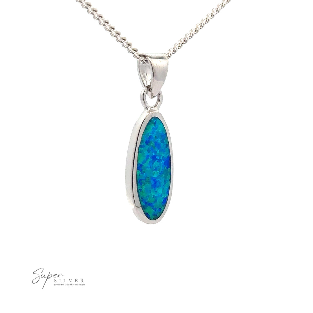 A Blue Opal Oval Pendant featuring an oval-shaped blue opal gemstone. The pendant, with a rhodium finish, hangs from a chain and "Super Silver" is visible in the corner.