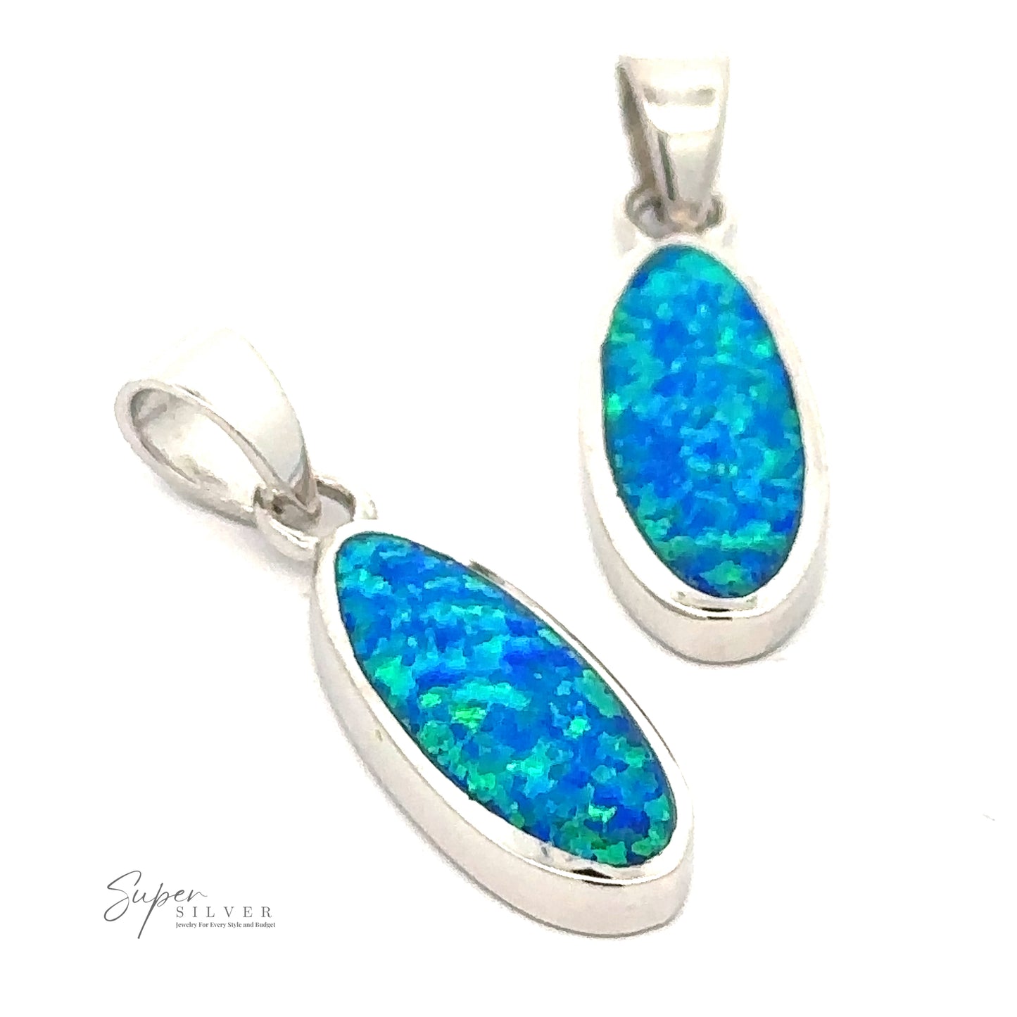 Two sterling silver pendants with oval-shaped blue and green opal stones are displayed against a white background. The pendants feature identical designs, a smooth polished rhodium finish, and showcase the captivating beauty of Blue Opal Oval Pendant.