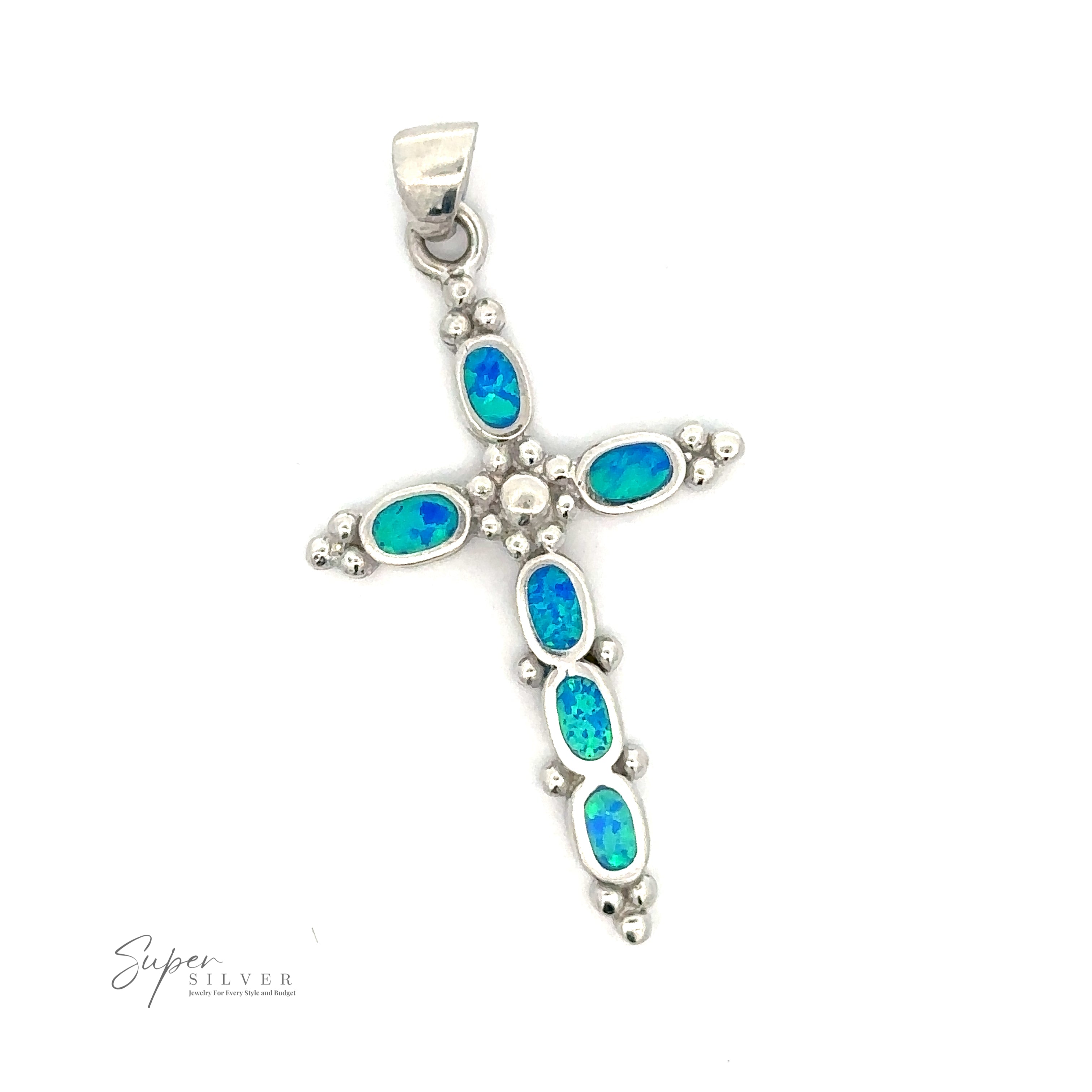 Blue Opal Cross Pendant With Oval Stones, featuring a bail at the top for easy attachment to a chain. "Super Silver" logo in the bottom left corner.