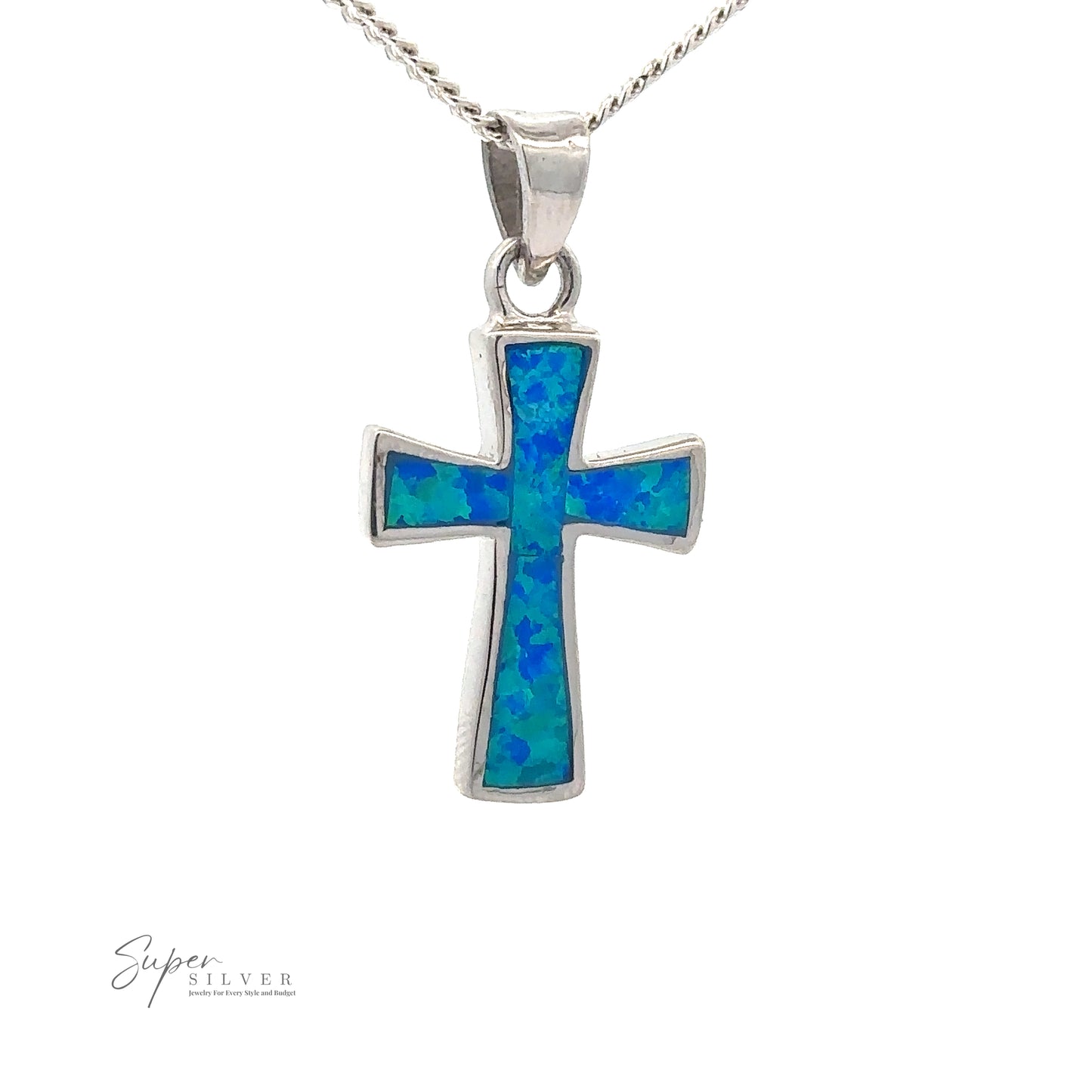 An Opal Cross Pendant, hanging on a gleaming rhodium finish silver chain. The background is plain white.