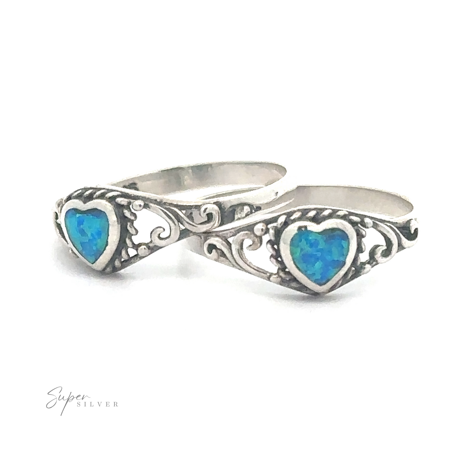 A pair of Dainty Blue Opal Heart Rings with filigree designs.