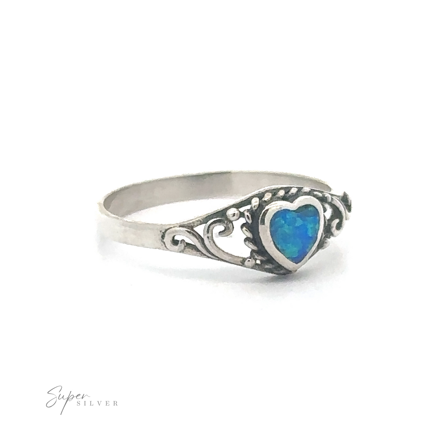 Dainty Blue Opal Heart Ring with an ornate filigree band.