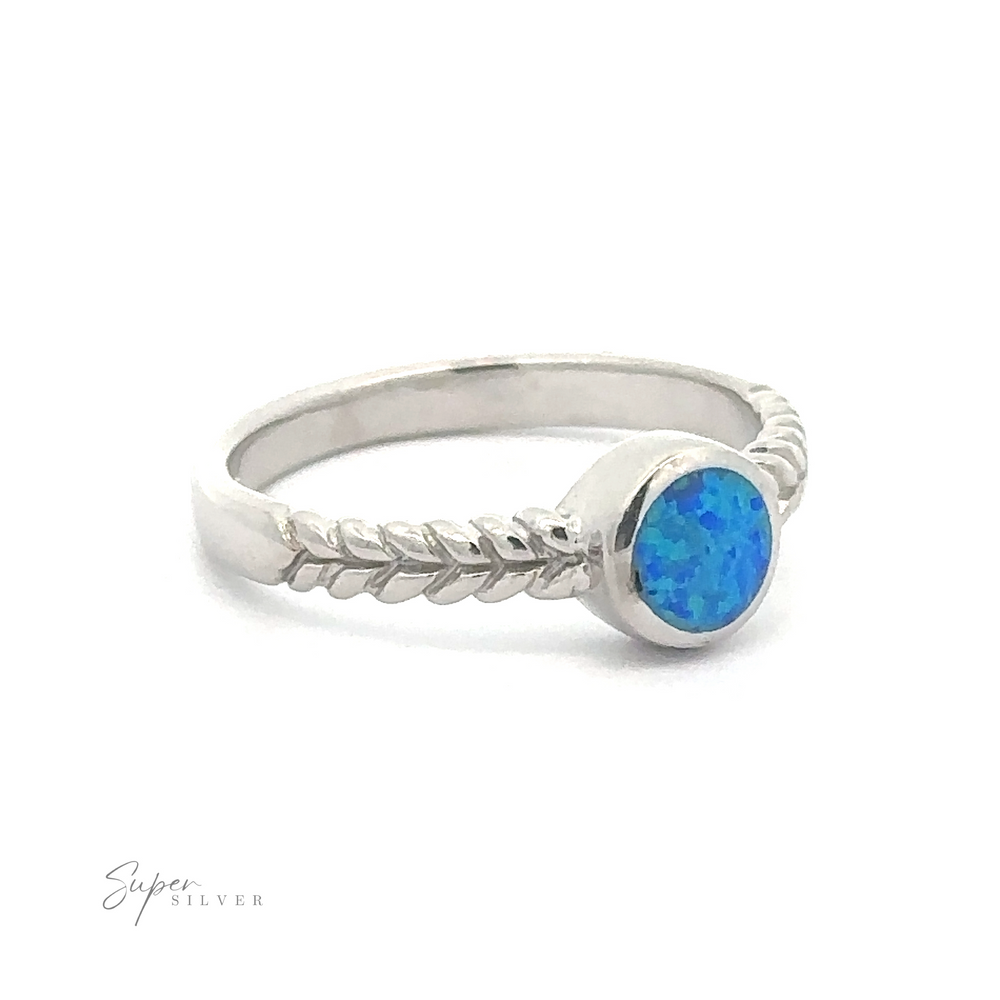 
                  
                    Half Braided Band with Round Opal with a blue lab opal stone set in a simple bezel setting, featuring a decorative rope-like side detail.
                  
                
