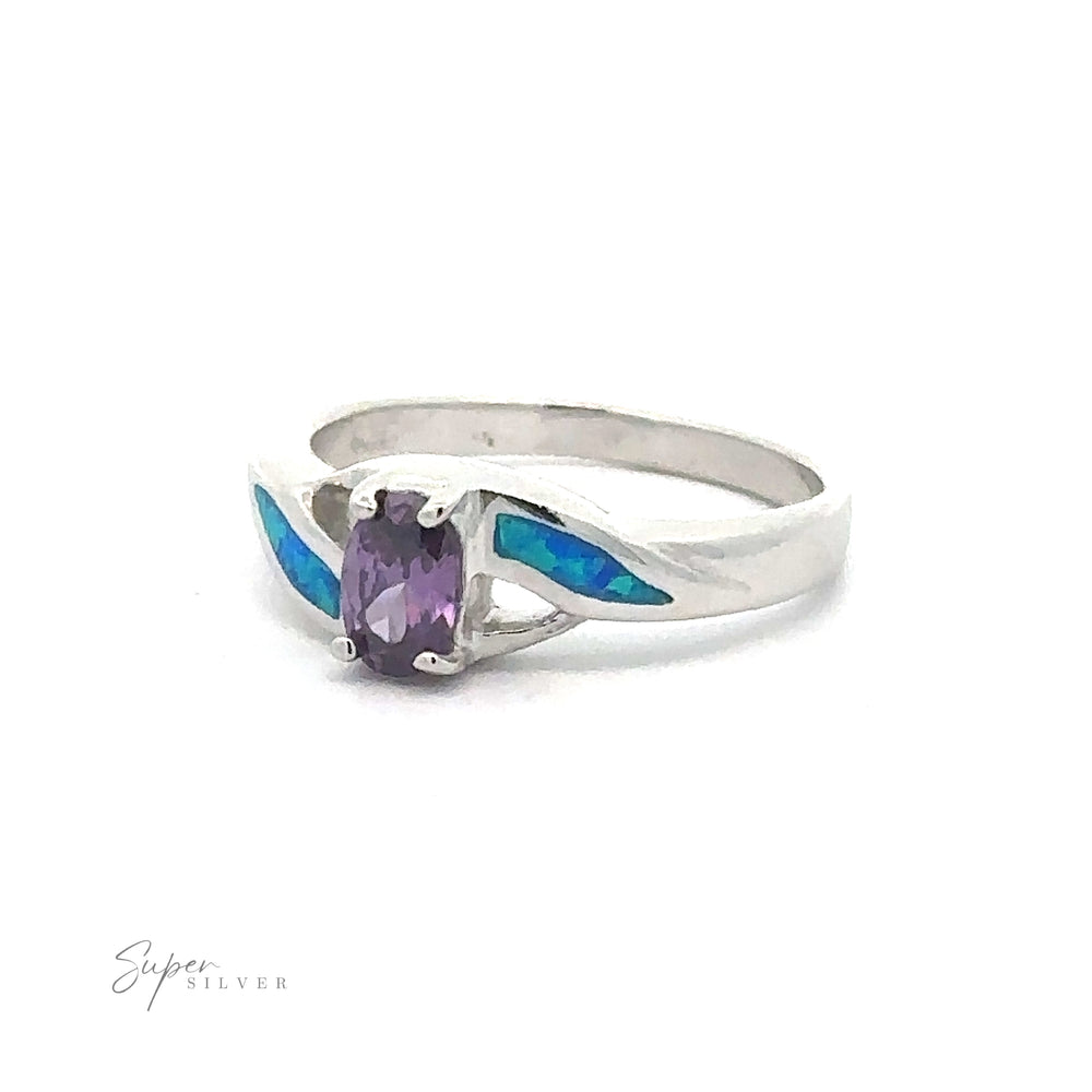 Blue Opal Ring with Purple Cubic Zirconia gemstone flanked by blue cubic zirconia inlay details.