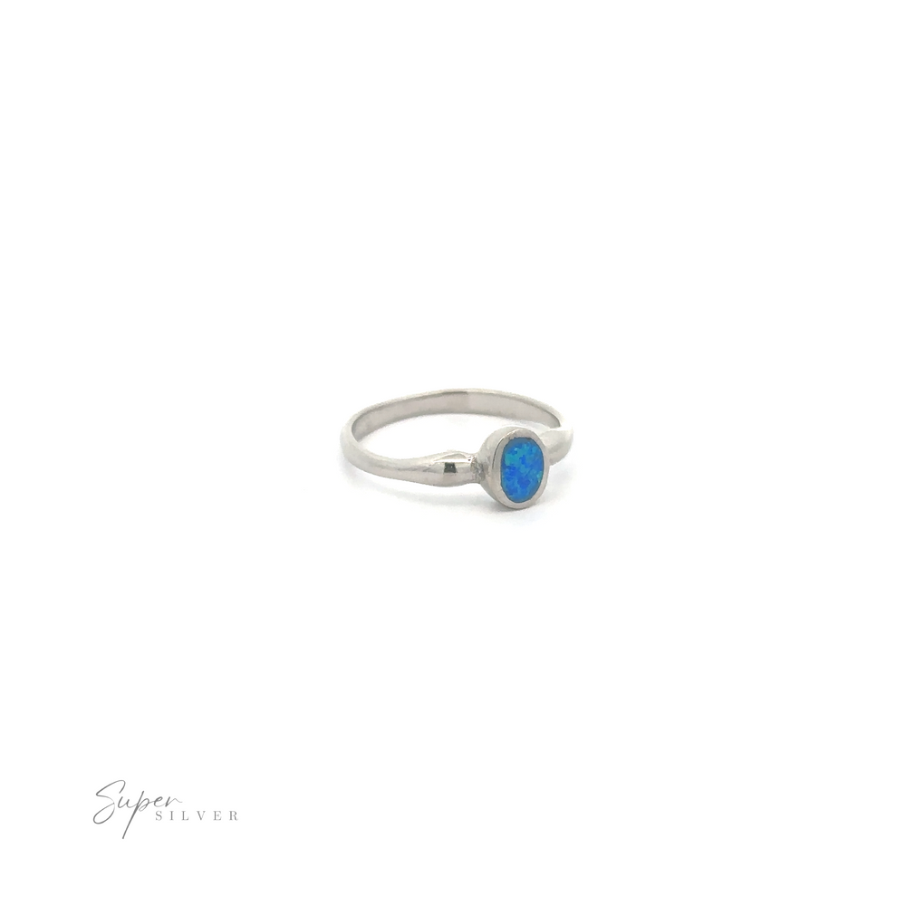 
                  
                    Petite Blue Lab Opal Ring with a white background.
                  
                