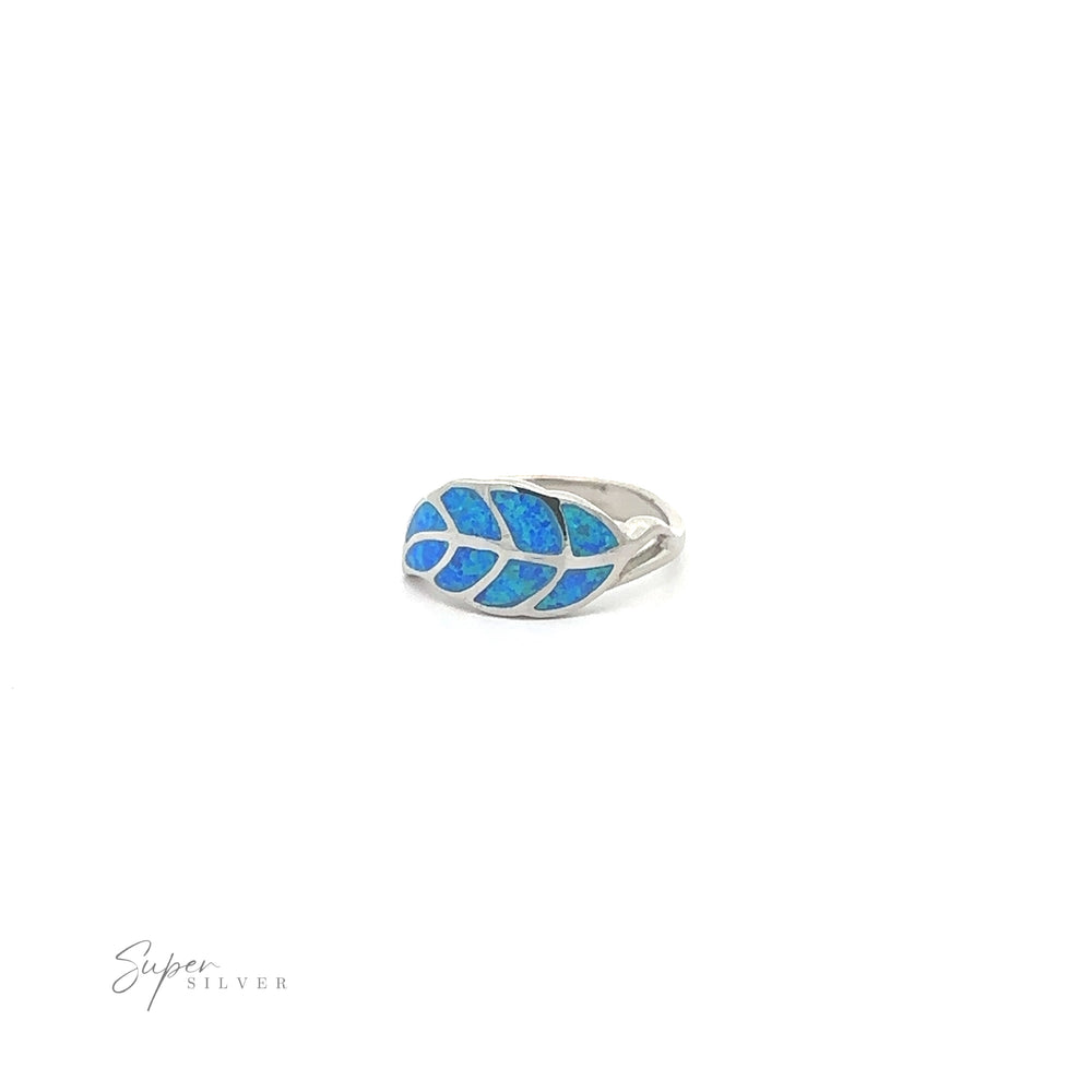 
                  
                    Lab Opal Feather Ring with ethereal blue inlay on a white background.
                  
                