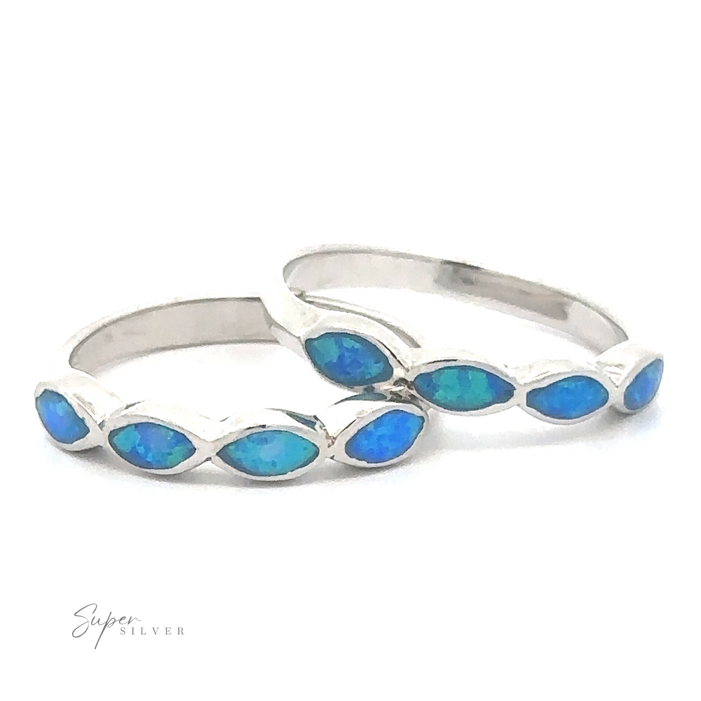 Two Stackable Blue Opal Rings With Marquise Stones.