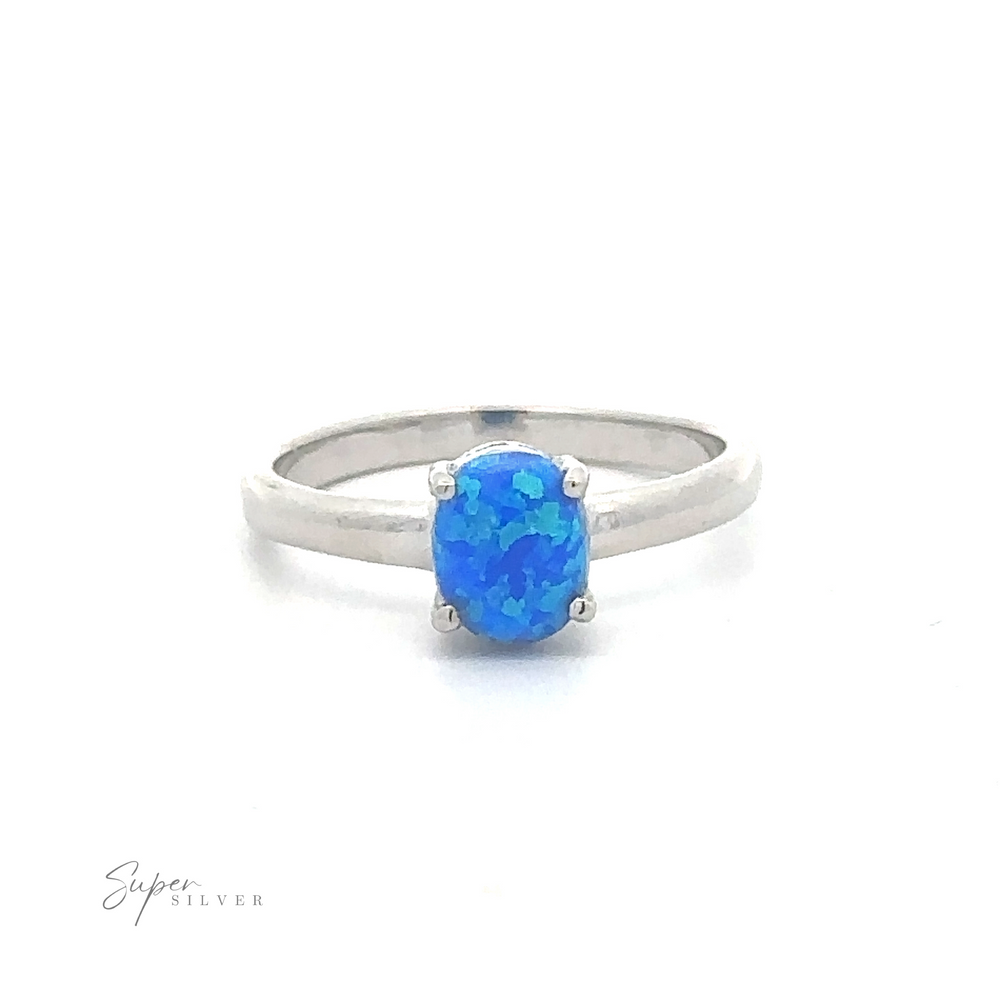 A sterling silver ring with a blue oval lab-created gemstone. -> Simple Pronged Lab Opal Ring