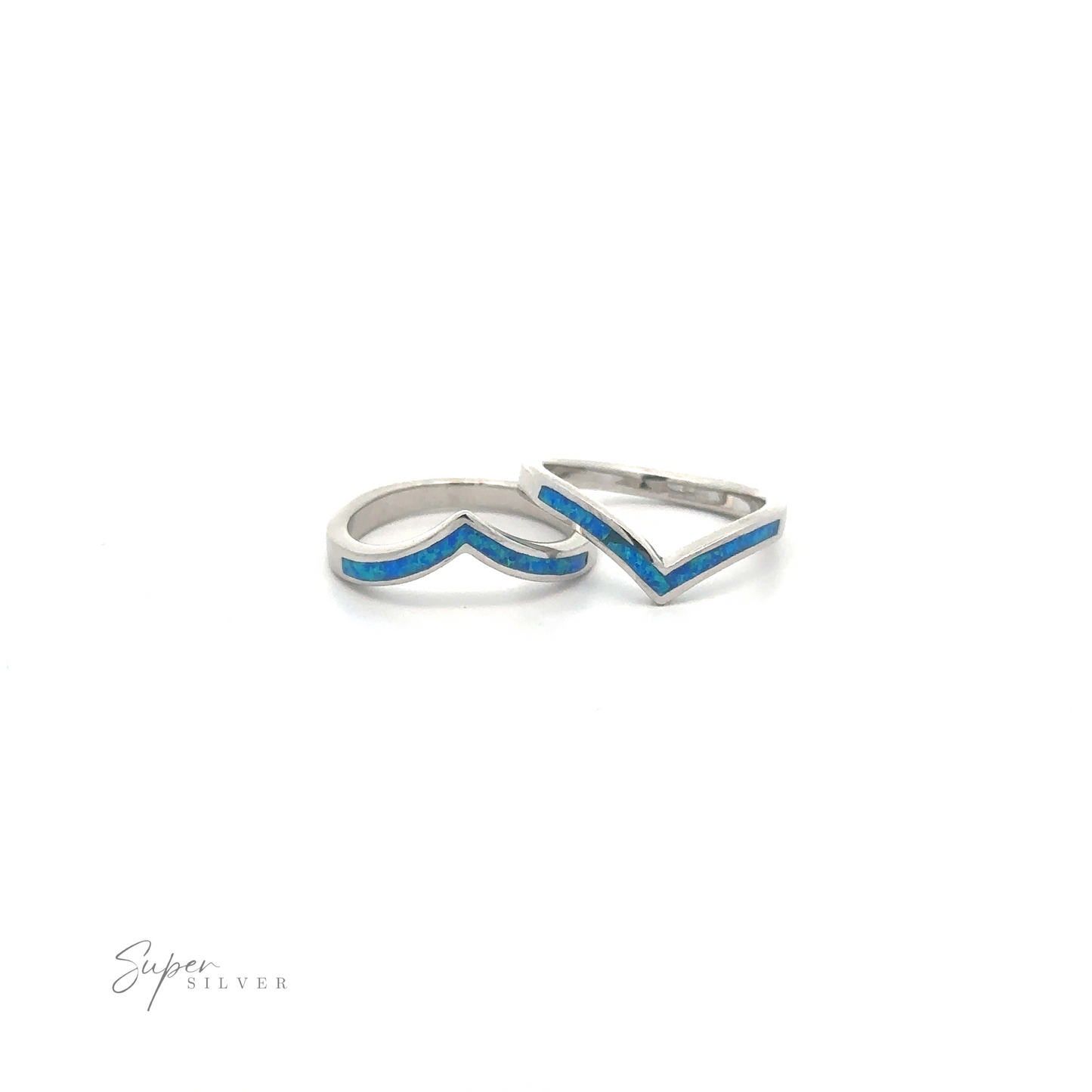 
                  
                    Pair of elegant silver Elegant Chevron Lab Opal Rings with blue detailing on a white background.
                  
                
