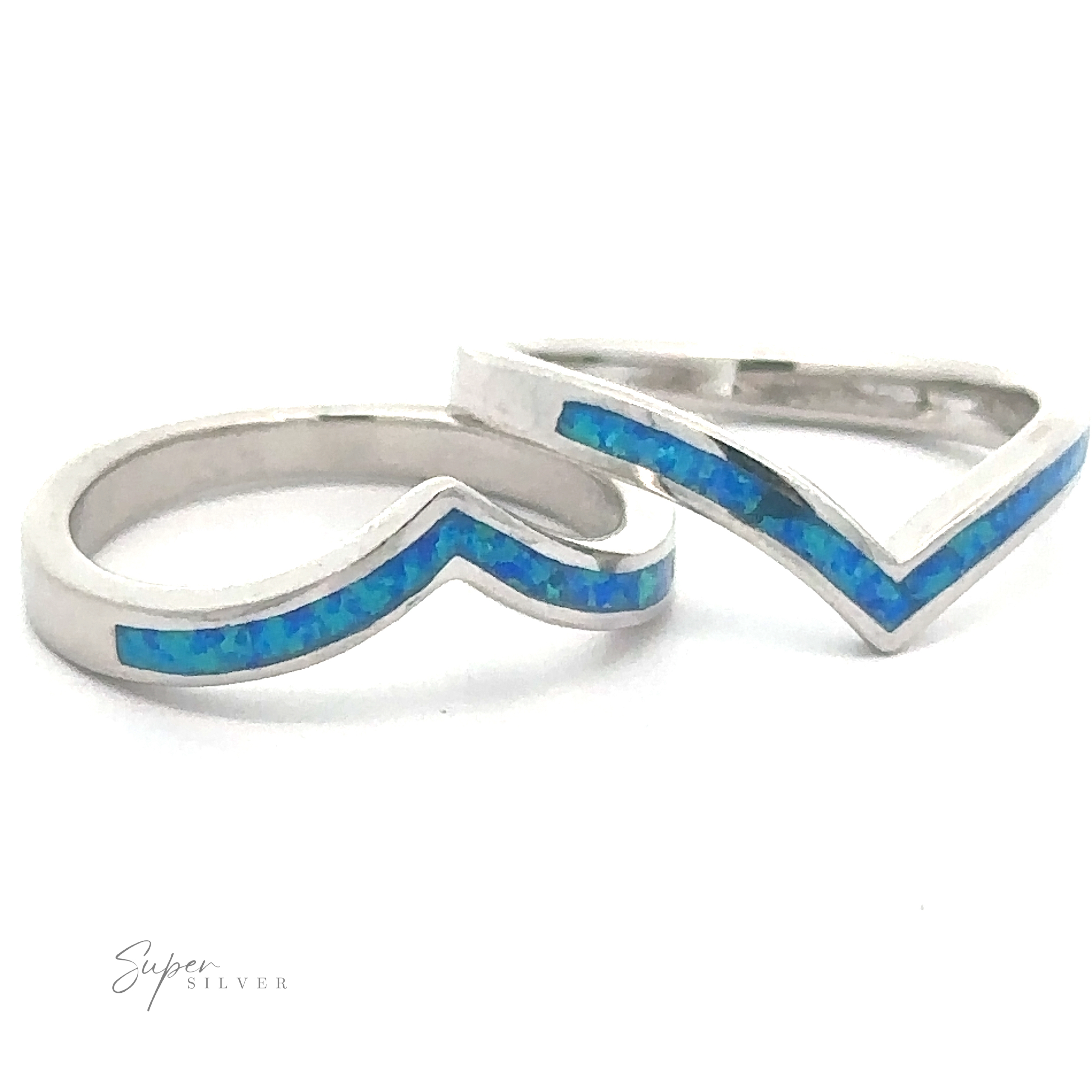 Pair of Elegant Chevron Lab Opal Rings with blue opal inlay on a white background.