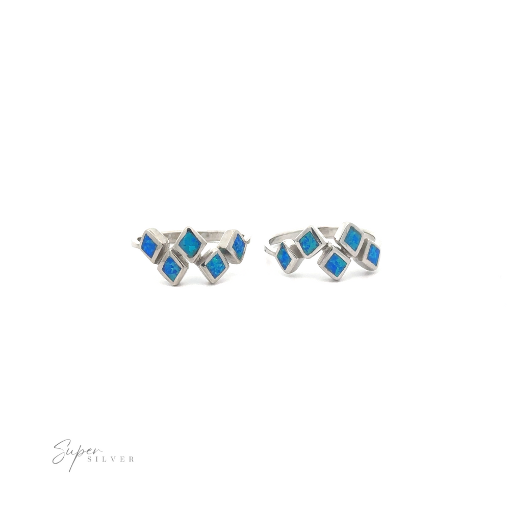 
                  
                    Pair of sterling silver earrings with blue gemstone accents in a geometric design, isolated on a white background.
                  
                