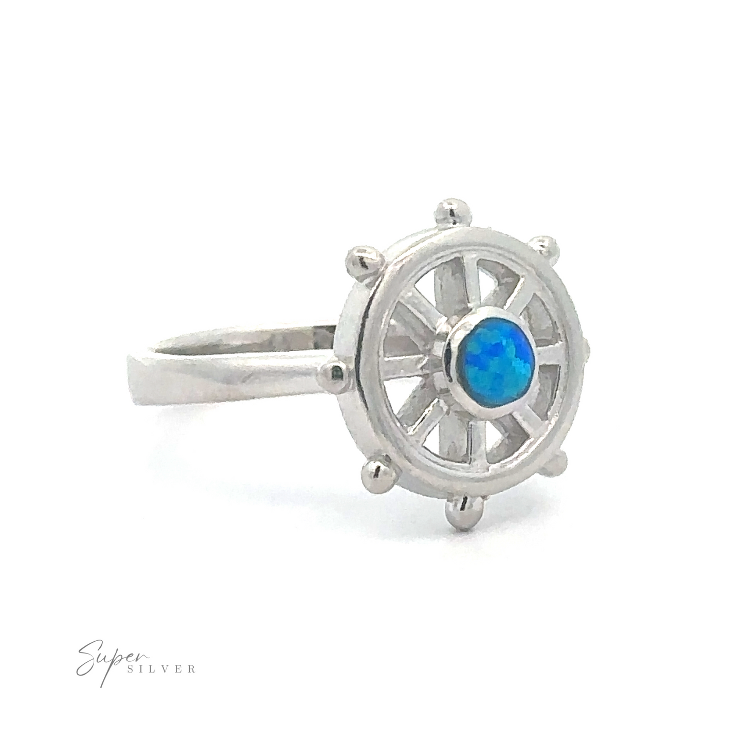 
                  
                    Ship Wheel Ring With Lab Opal designed to resemble a ship's wheel with an opal stone at the center.
                  
                
