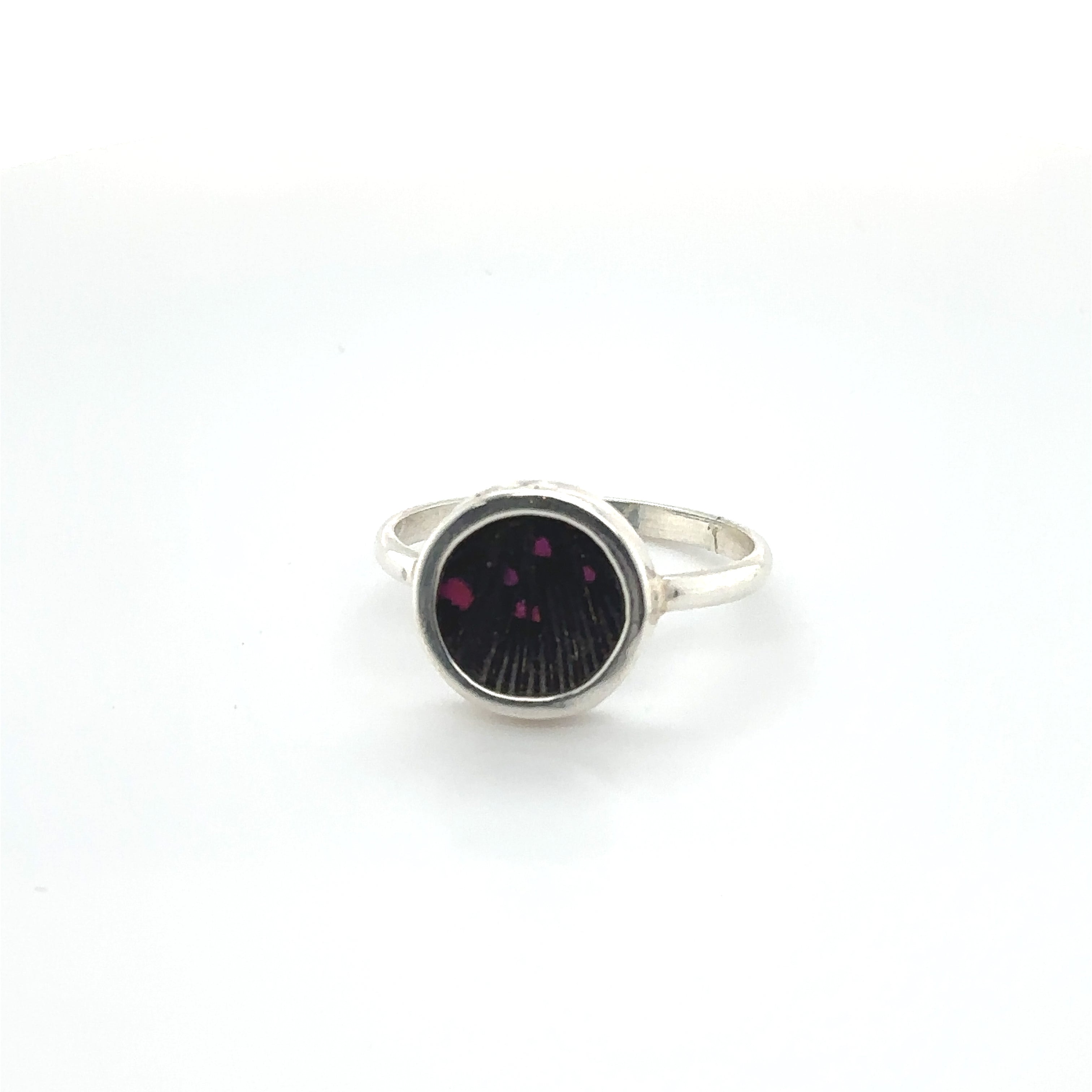 A Butterfly Wing Ring in Circle Shape adorned with a vibrant black and purple stone from Super Silver.