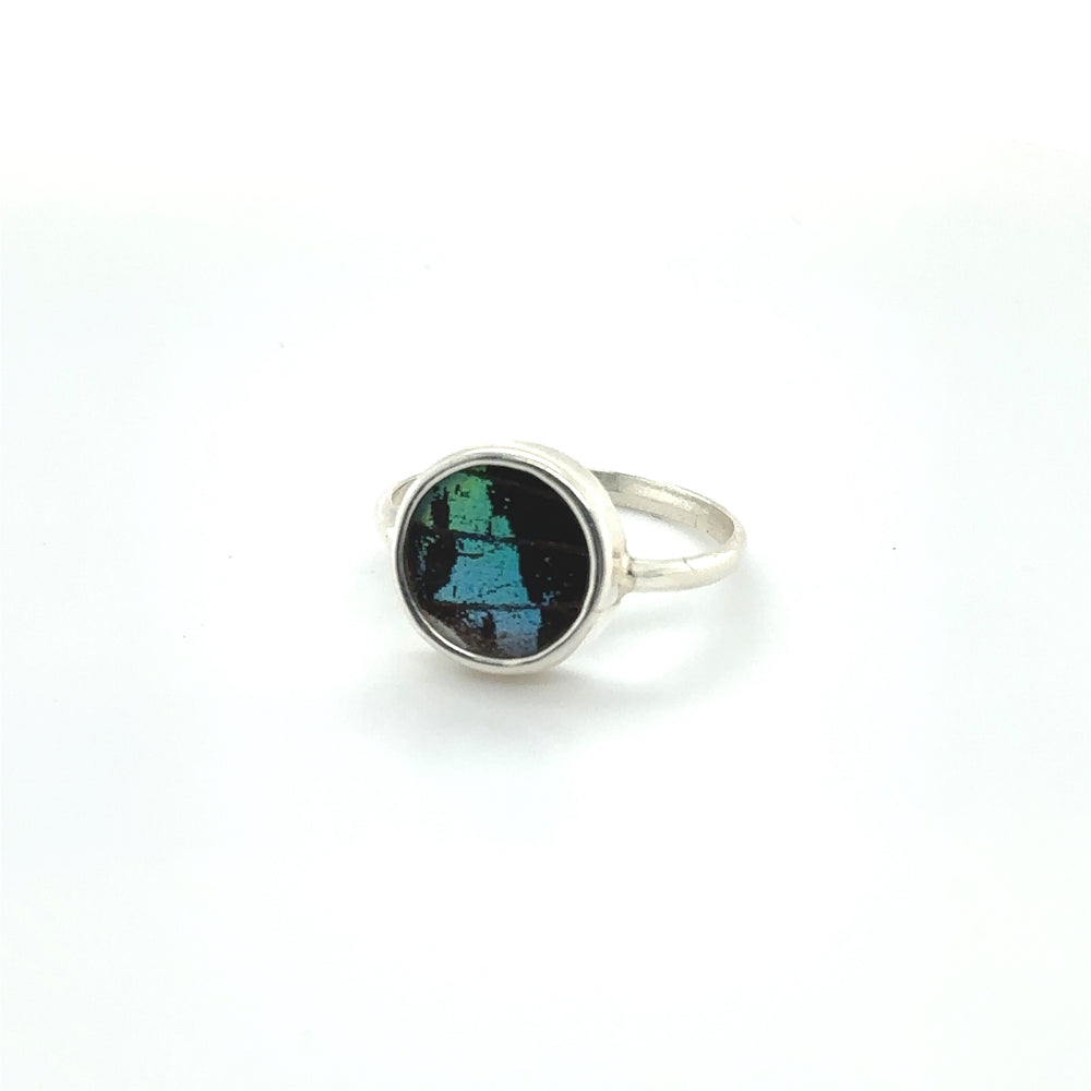
                  
                    A sterling silver Butterfly Wing Ring in Circle Shape with a black and green stone.
                  
                
