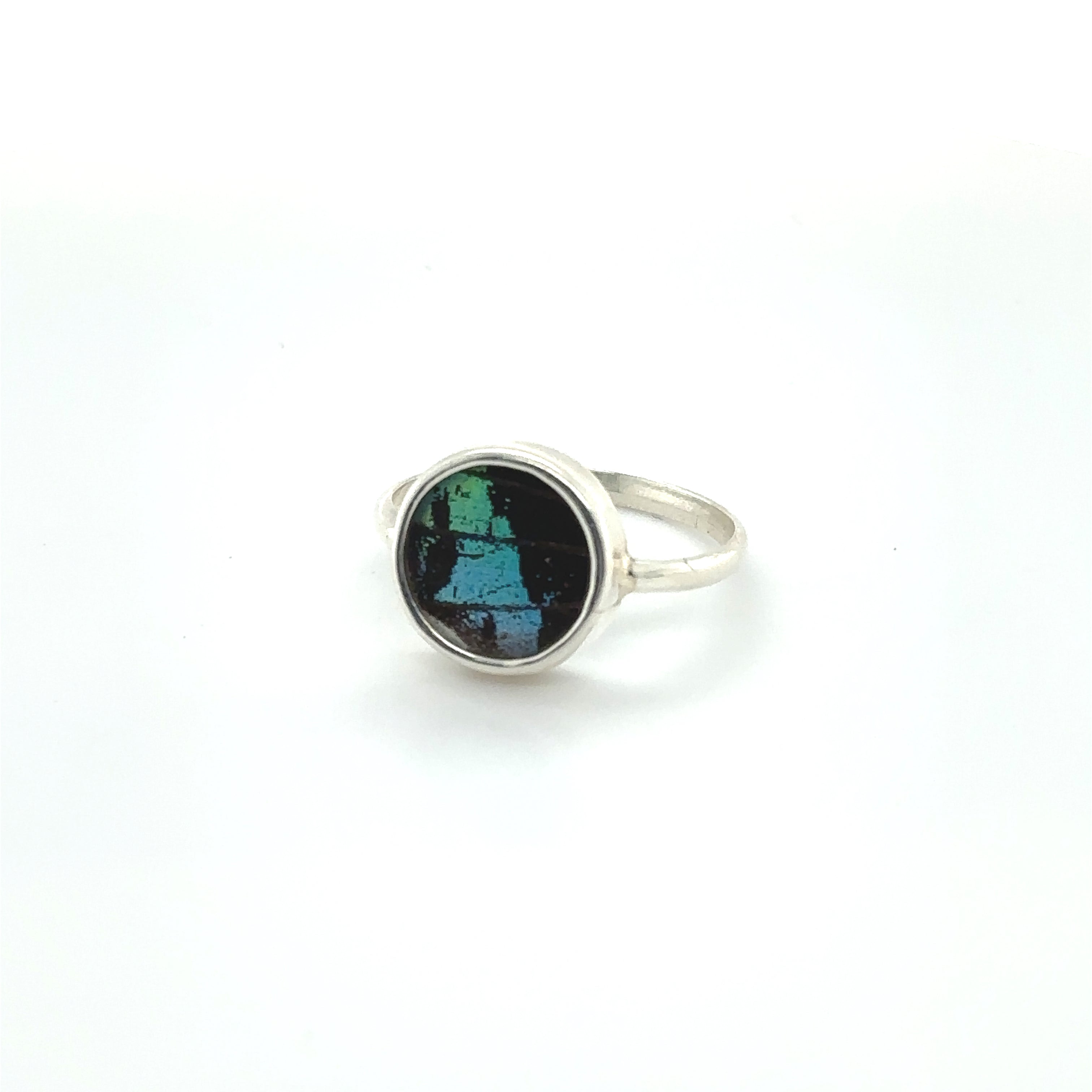 A sterling silver Butterfly Wing Ring in Circle Shape with a black and green stone.