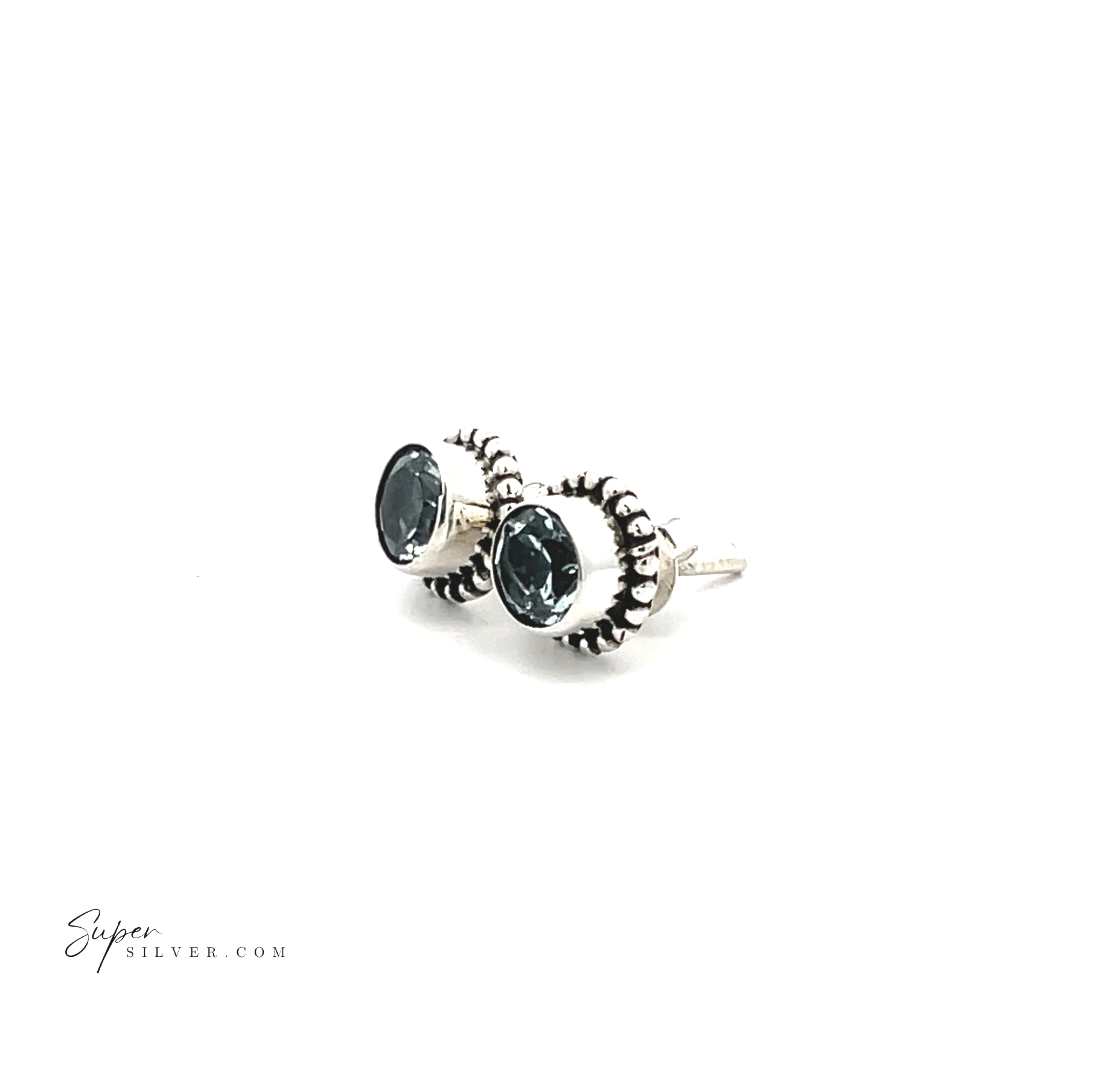 Beaded Round Faceted Gemstone Studs: round sterling silver earrings with dark gemstone centers and decorative beaded edging, shown on a white background.