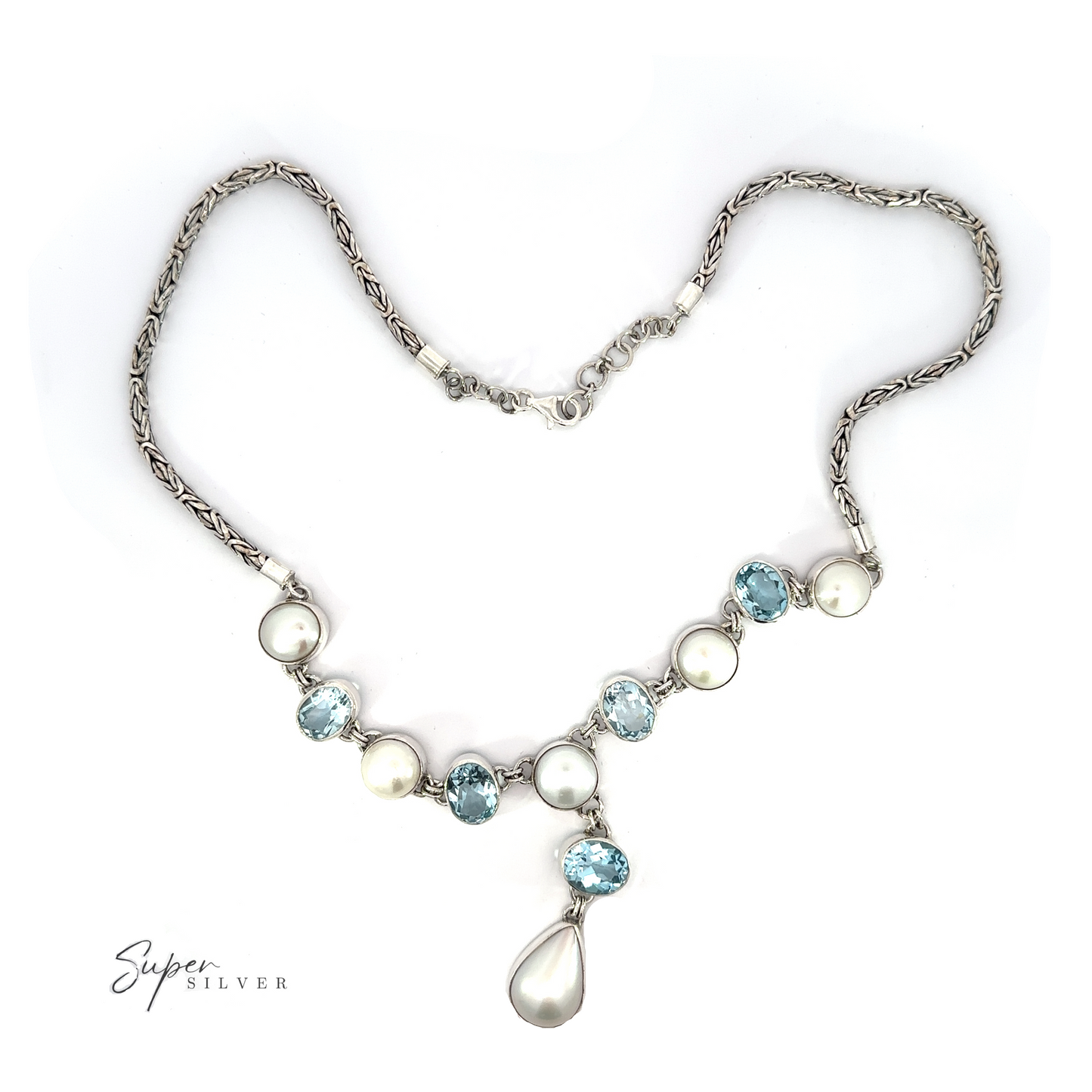 
                  
                    A Stunning Pearl and Gemstone Statement Necklace featuring a combination of gemstones and pearls with a single pearl drop pendant, displayed on a white background. The brand "Super Silver" is visible in the bottom corner.
                  
                