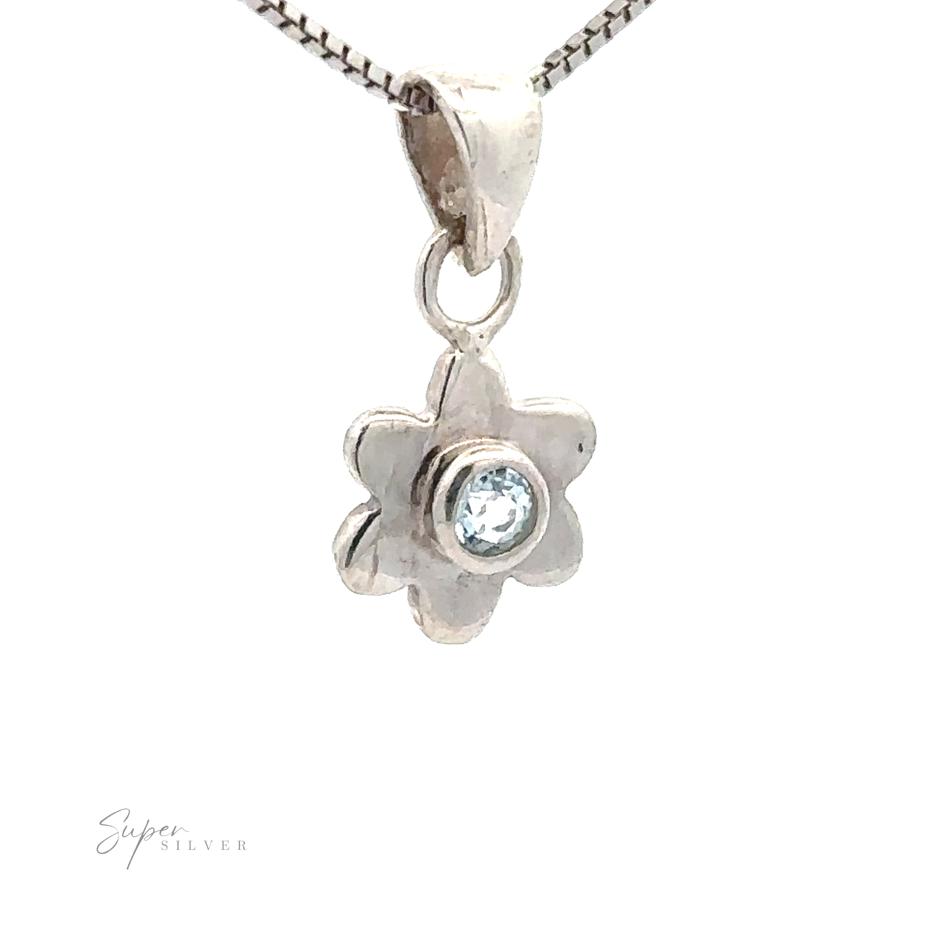 A Tiny Gemstone Flower Pendant with a small, round blue gemstone center elegantly hangs on a matching silver chain.