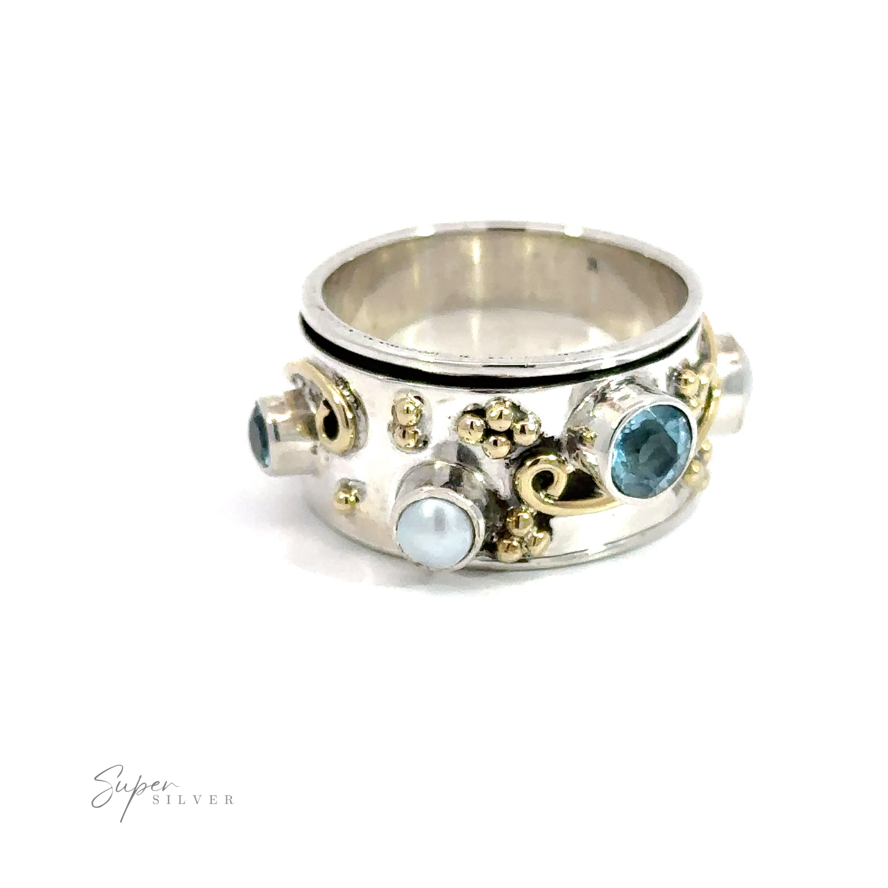 A silver Pearl and Blue Topaz Spinner with Gold Accents featuring a thick spinner band.
