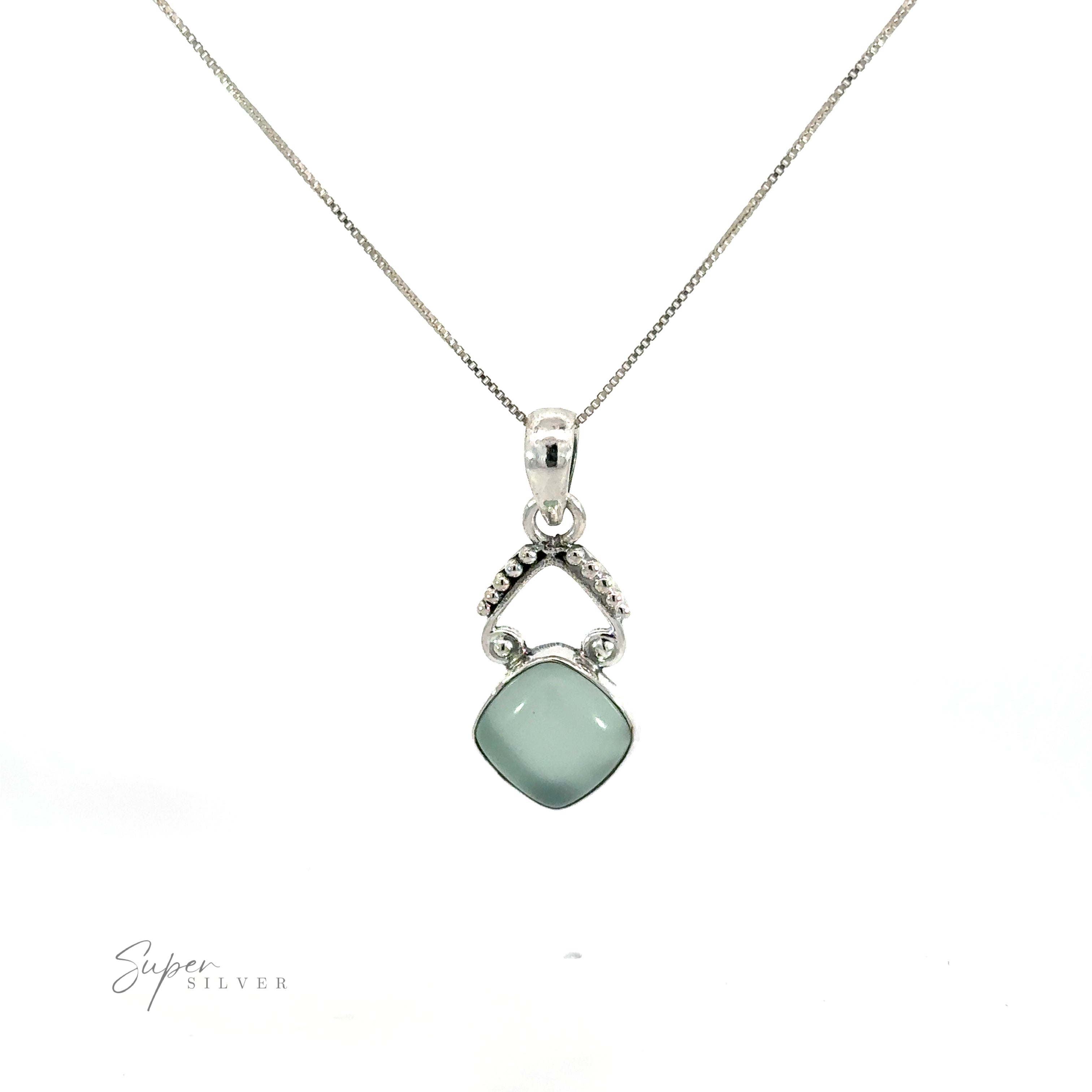 A diamond-shaped gemstone pendant with a green jade stone.