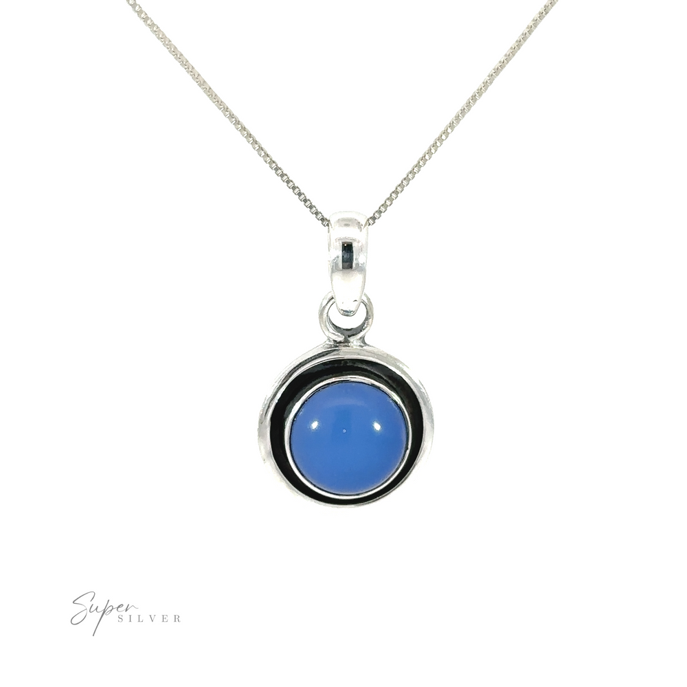 
                  
                    A Minimalist Round Gemstone Pendant with a blue stone and oxidized edge.
                  
                