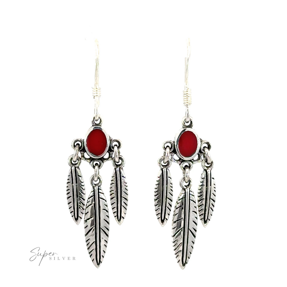 
                  
                    A pair of Western Inspired earrings with feather dangles and inlay stones on a white background.
                  
                