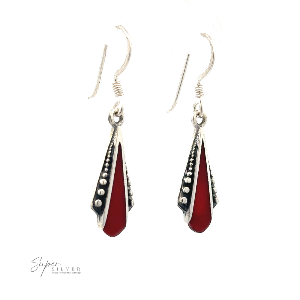 A pair of Inlaid Teardrop Shaped Bali Inspired Earrings, featuring a red triangular pendant with black accents and small silver bead details, inspired by the vibrant artistry of Bali. "Super Silver" logo visible at the bottom left.