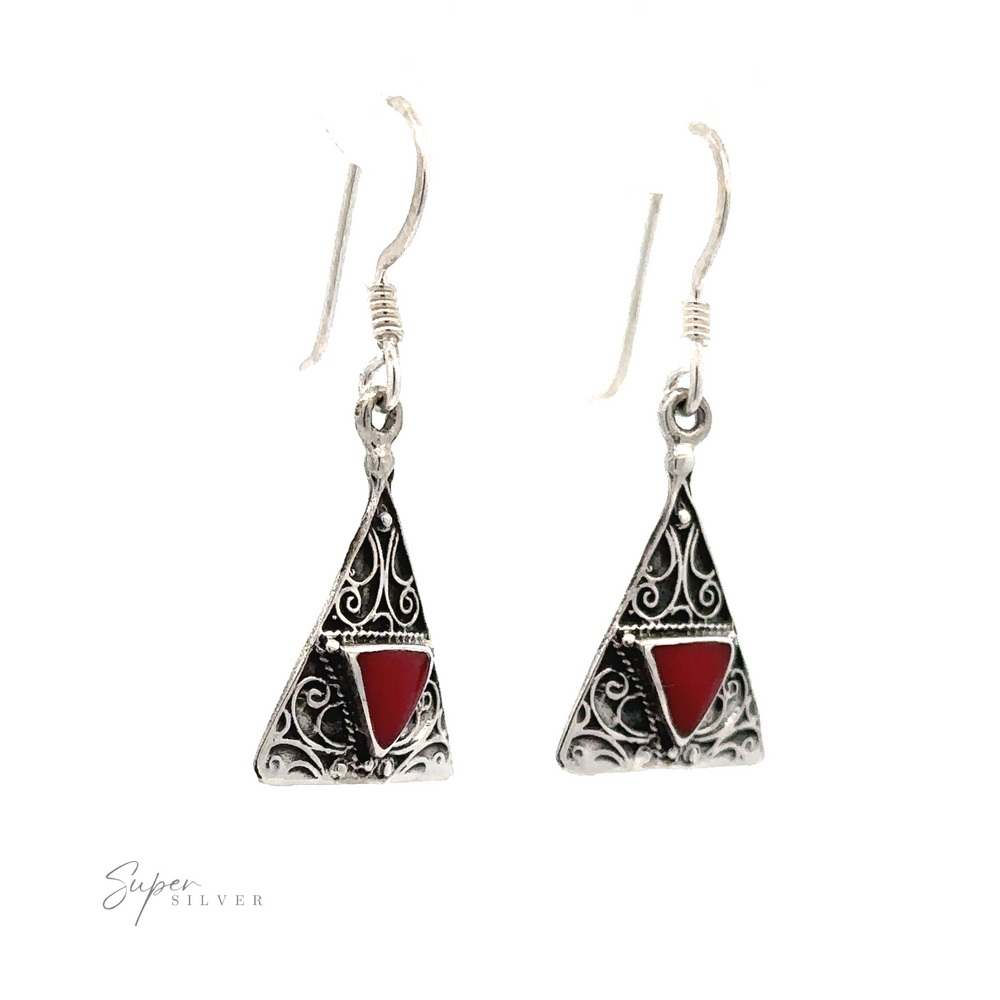 A pair of Freestyle Design Triangle Shape Inlaid Earrings featuring triangular shapes with red coral stone inlays and intricate filigree designs, attached to hook earwires. Brand name 'Super Silver' visible at the bottom left.
