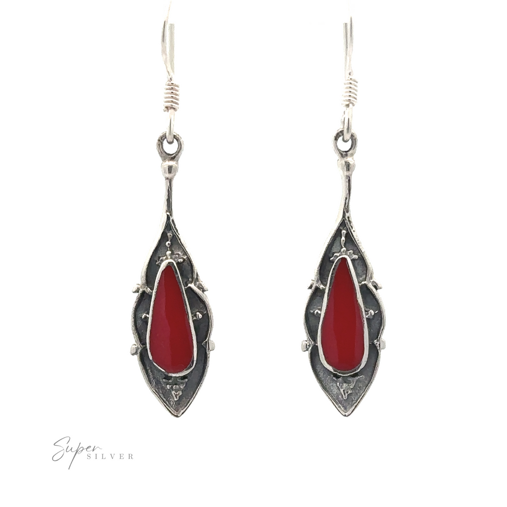 
                  
                    Pair of Teardrop Shape Inlaid Earrings with red teardrop-shaped stones in the center.
                  
                