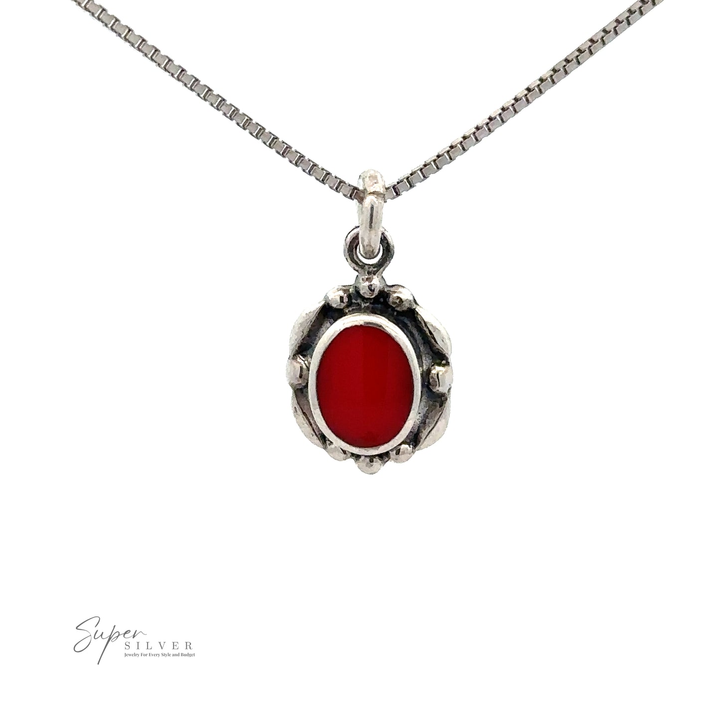 
                  
                    Beautiful Oval Stone Pendant With Silver Border: A silver necklace with an oval red gemstone pendant, featuring a beaded border design. The thin chain is crafted in sterling silver with a box chain style.
                  
                