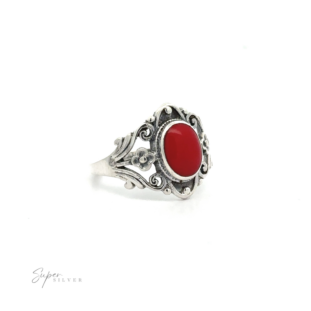 
                  
                    A Floral Filigree Inlay Stone Ring with a red stone.
                  
                