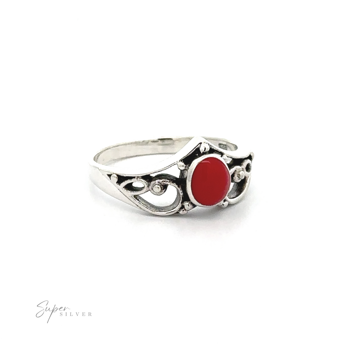 
                  
                    Filigree Crown Ring with Inlaid Oval Stone with a red stone, exuding vintage vibes.
                  
                