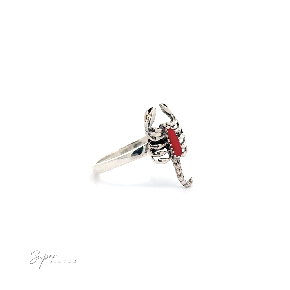 
                  
                    Small Scorpion Ring with Inlaid Stone with a red accent.
                  
                