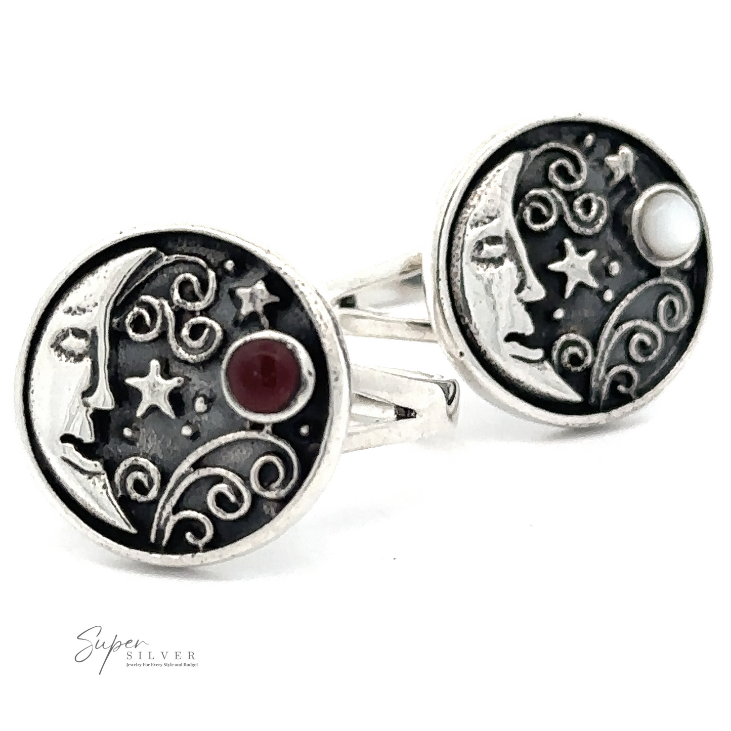 Two .925 Sterling Silver rings depicting a crescent moon with a sleeping face and swirling designs, featuring a red stone and a white stone, by Super Silver. These Circular Vintage Style Moon Rings With Inlaid Stone exude Bohemian charm, making them an enchanting addition to any jewelry collection.