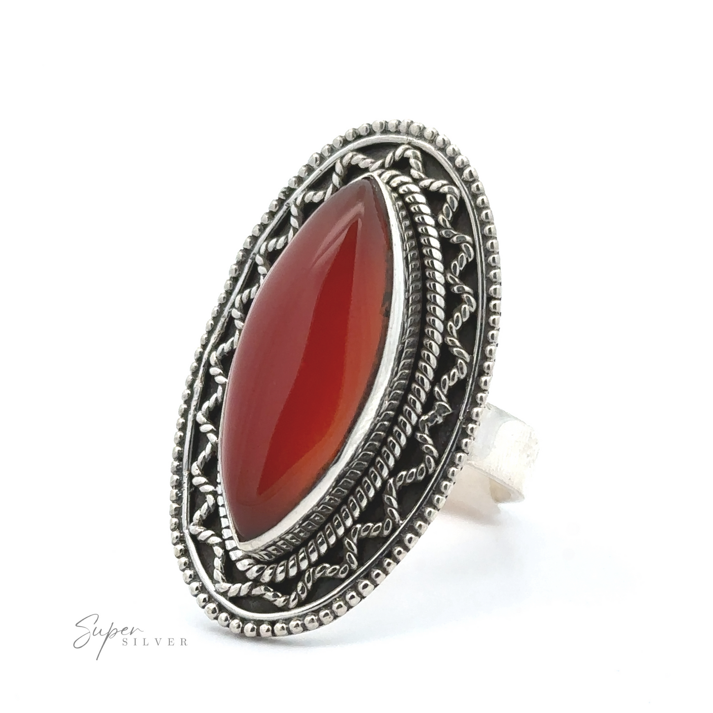 
                  
                    A Marquise Shaped Gemstone Ring With Vintage Shield Border featuring an oval-shaped red gemstone set in an ornate, intricately designed band with a bohemian twist.
                  
                