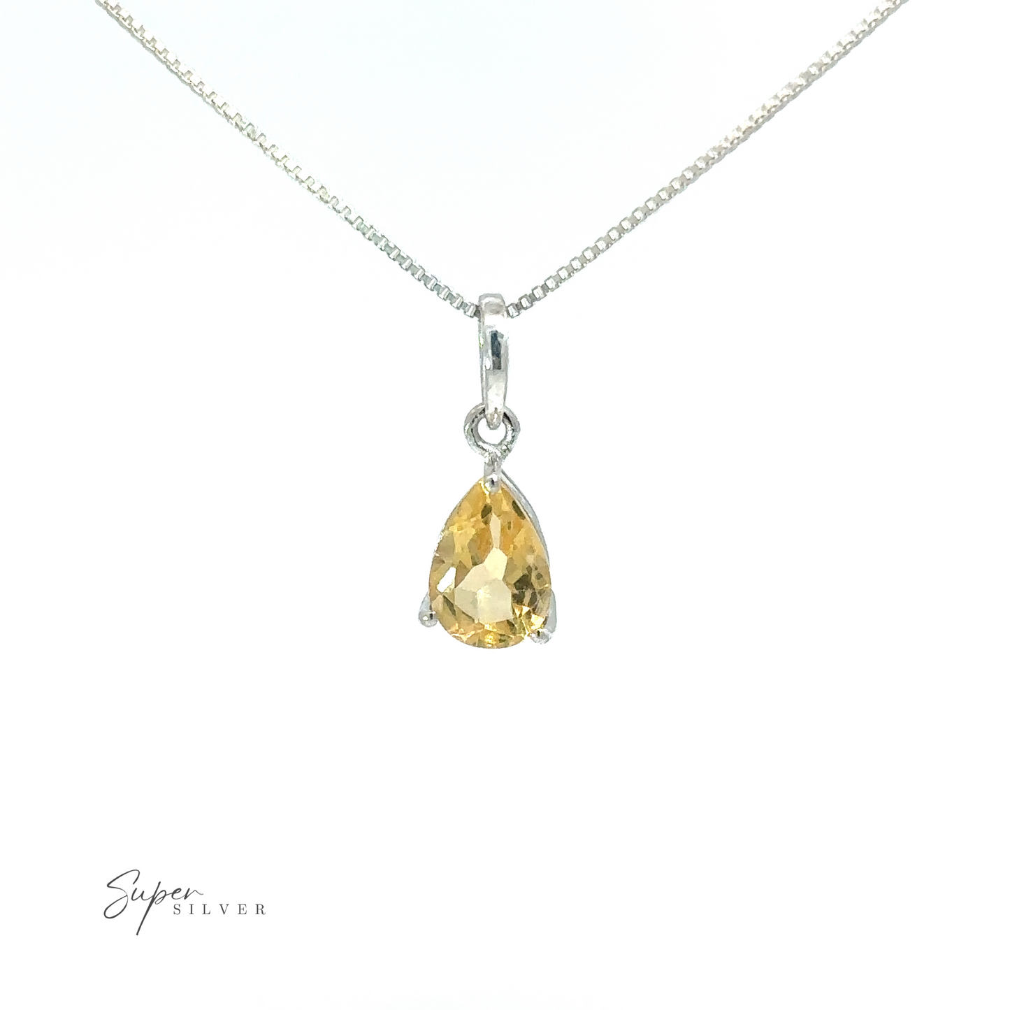 
                  
                    A minimalist style Dainty Faceted Gemstone Pendant on a silver chain shaped like a tiny teardrop gemstone.
                  
                