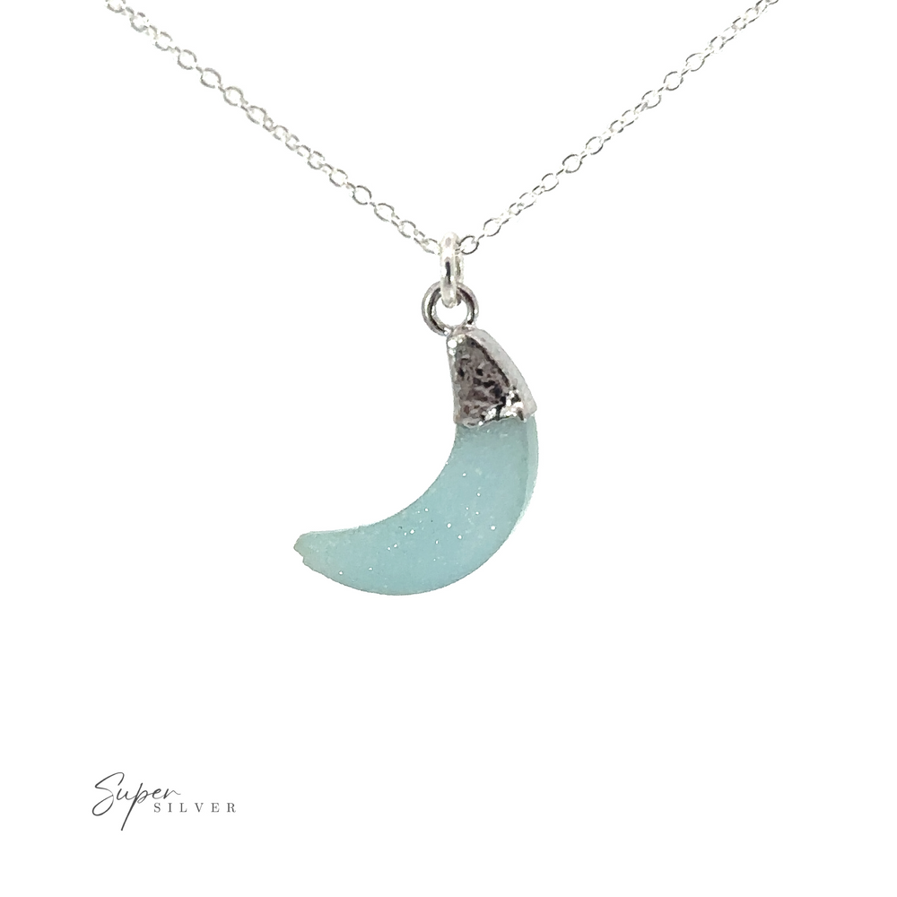 
                  
                    A Delicate Stone Moon Necklace with a blue moon pendant.
                  
                