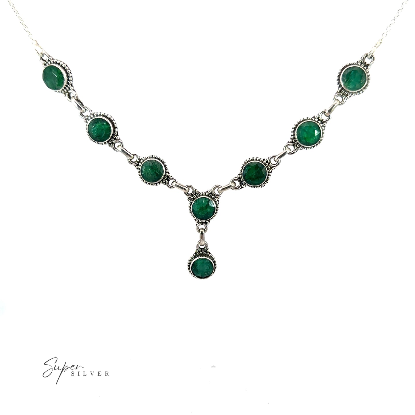 
                  
                    A Round Gemstone Y Necklace with Ball Border with green gemstones arranged in a V-shape, featuring the branded text "Super Silver" at the bottom left. This bohemian style jewelry piece effortlessly combines elegance and charm.
                  
                