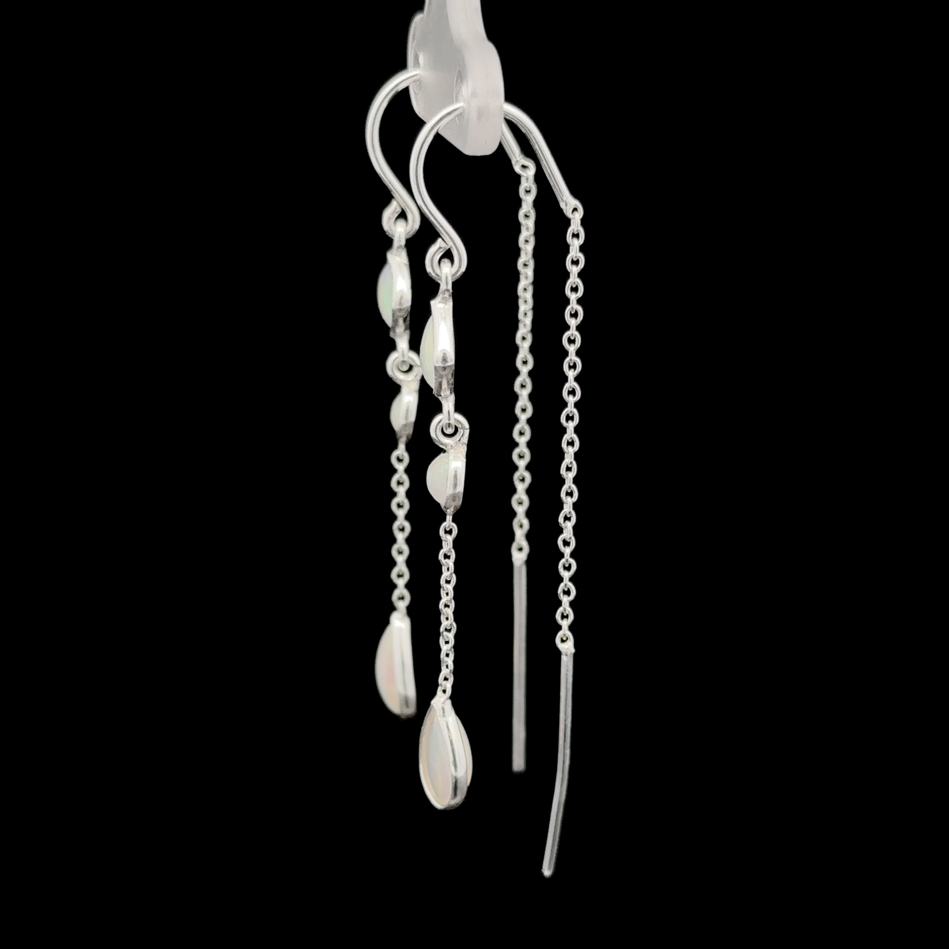 Pair of Ethiopian Opal Threader Earrings with chain and bead detailing, showcasing contemporary design in sterling silver jewelry against a black background.