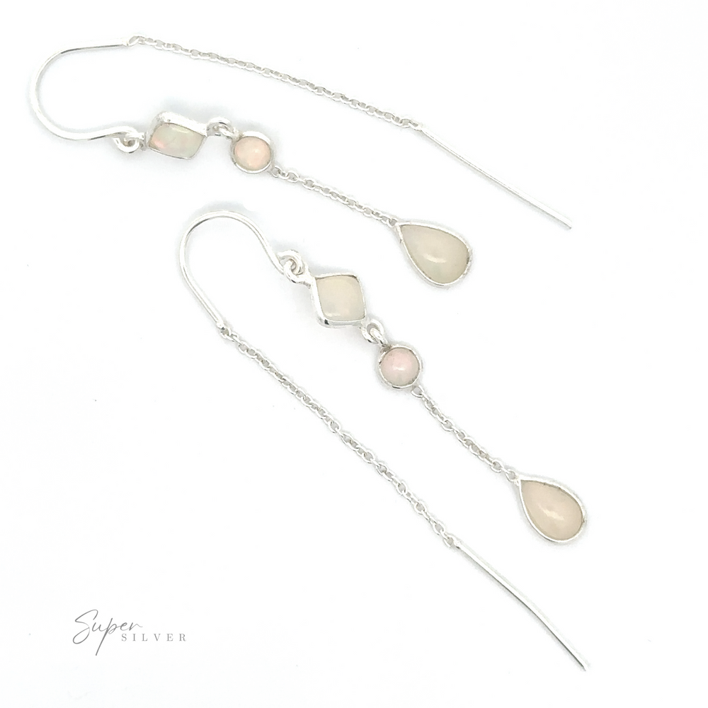 A pair of Ethiopian Opal Threader Earrings with geometric shapes and small gemstones, including Ethiopian opals, displayed on a white background. One earring is laid out straight while the other curves upward. The "Super Silver" logo graces the corner.