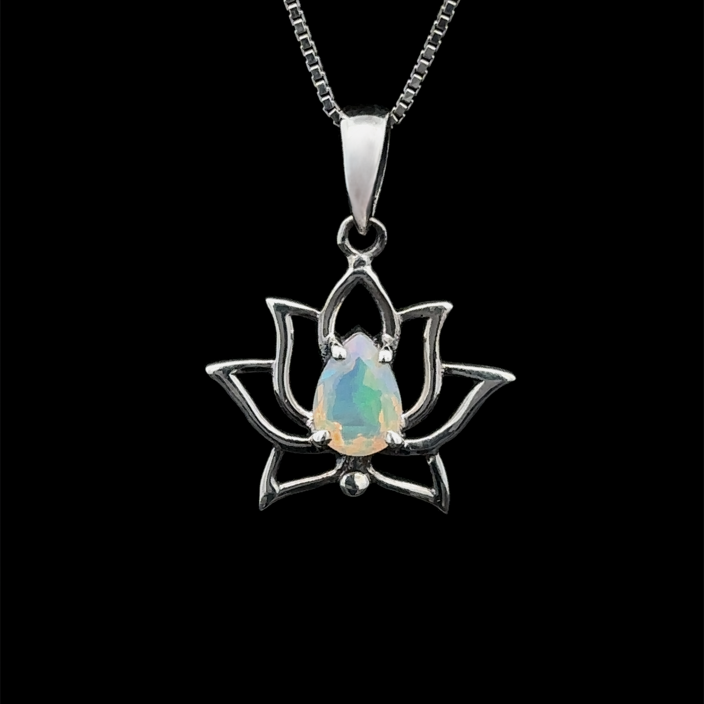 
                  
                    The Ethiopian Opal Lotus Pendant features a captivating Ethiopian opal gemstone at its center, elegantly set in sterling silver and suspended from a chain against a black backdrop.
                  
                