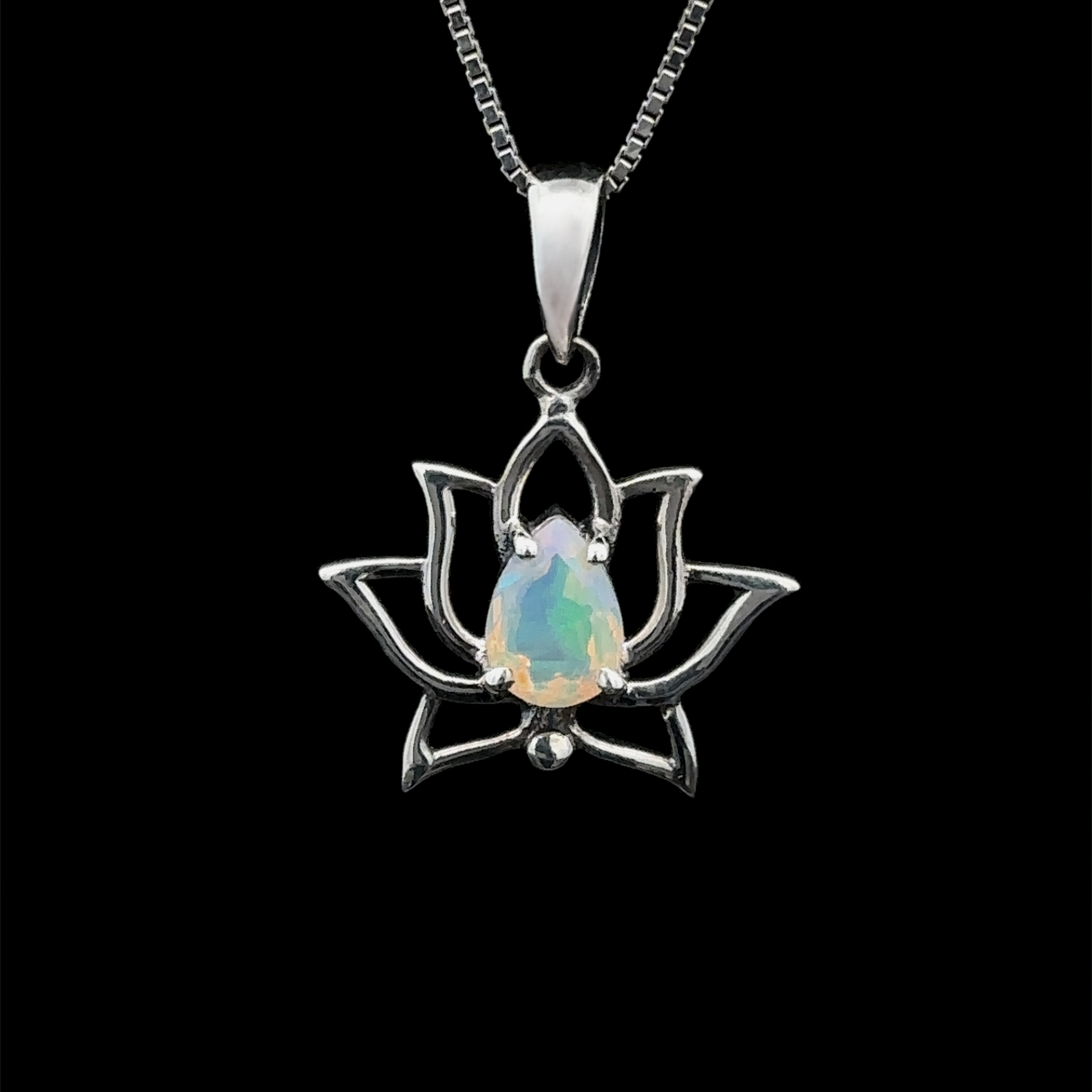 The Ethiopian Opal Lotus Pendant features a captivating Ethiopian opal gemstone at its center, elegantly set in sterling silver and suspended from a chain against a black backdrop.
