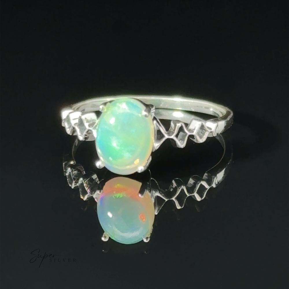 
                  
                    Pronged Ethiopian Opal with Diamond Pattern ring displayed against a dark background with a reflection underneath.
                  
                