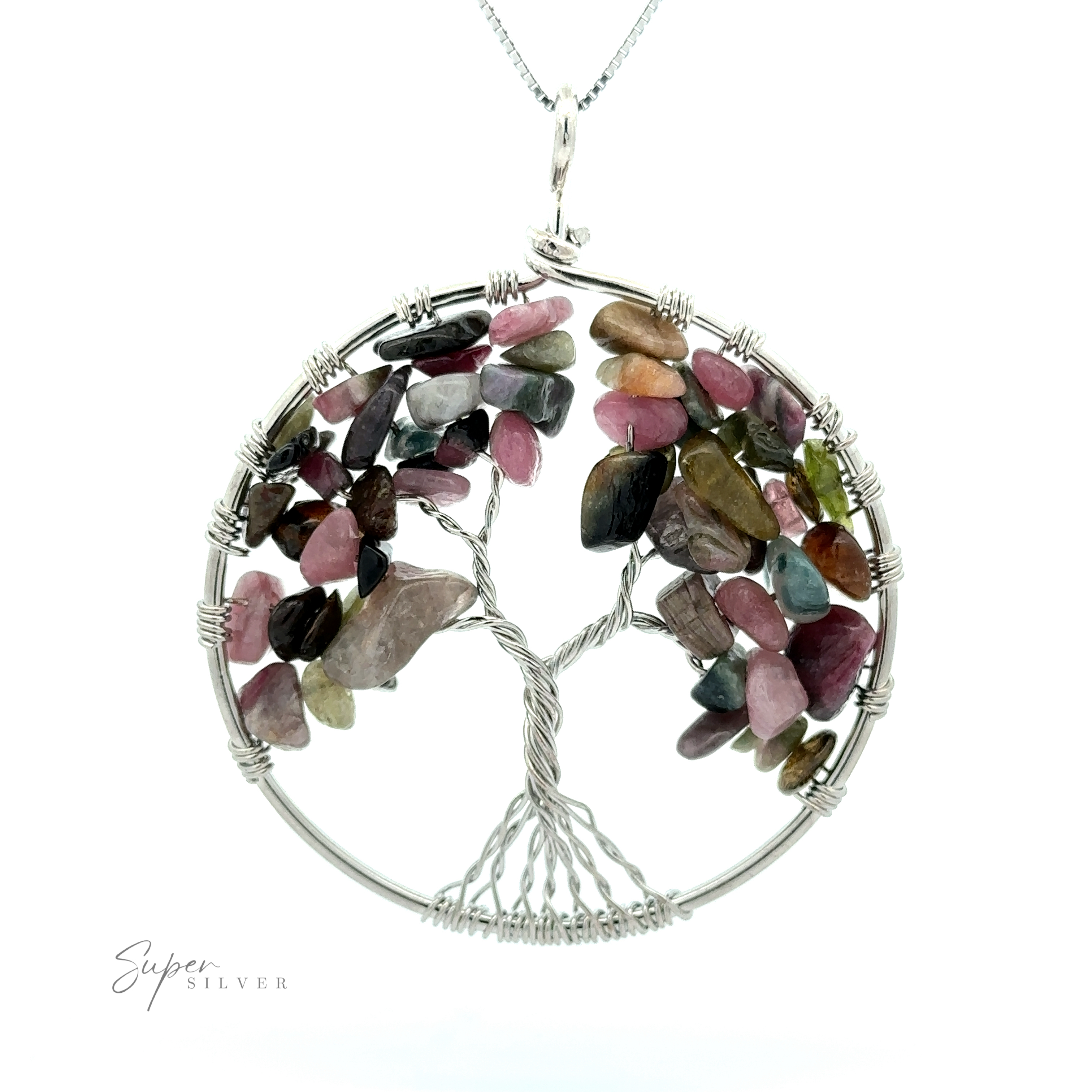 A Wire Wrapped Tree of Life Pendant featuring a wire tree with multicolored, polished stone leaves encased in a circular frame. The necklace's chain, crafted from mixed metals, is partially visible at the top.